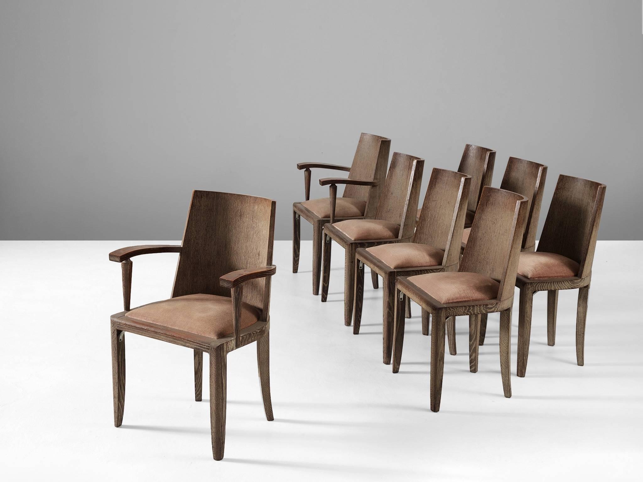 De Coene, set of six chairs, in oak and fabric, Belgium, 1930s. 

Interesting set of six dining chairs. The chairs have an oak frame, four tapered legs, of which the back are sloping. Sturdy large curved back and soft rose upholstery. The curved