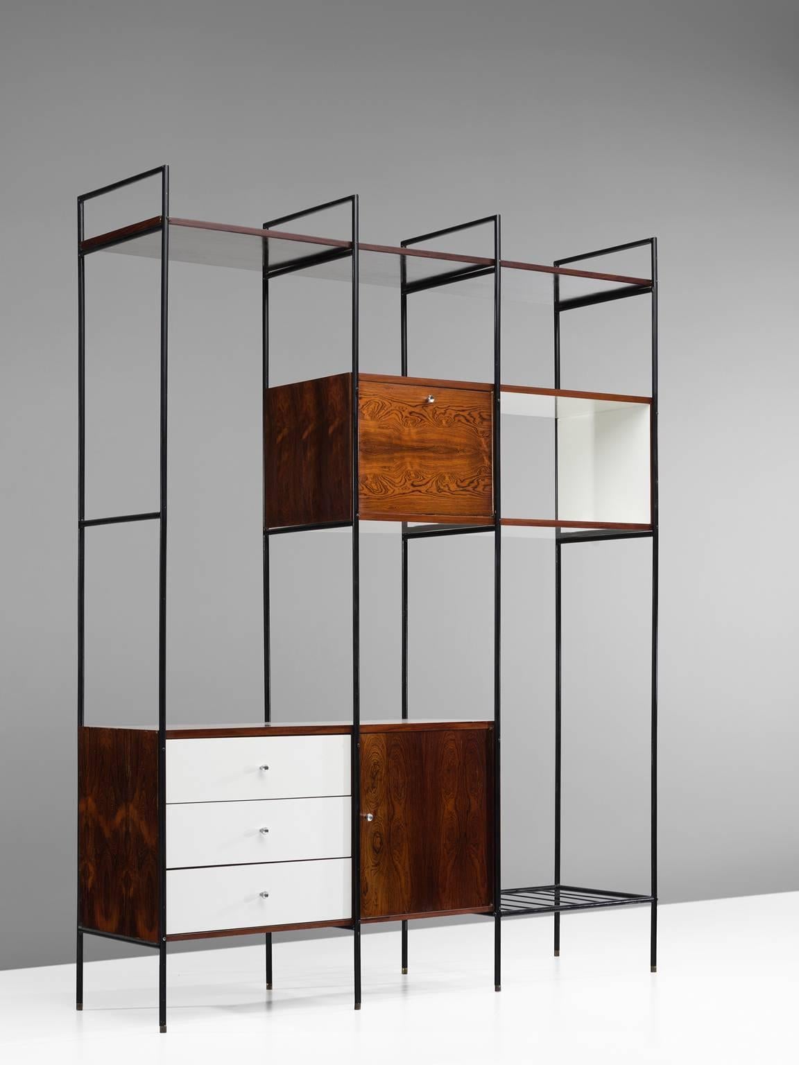 Geraldo de Barros, wall unit MF 710 Bookshelf, iron, plywood veneered with white Formica and rosewood, Brazil, 1954.

Slender wall unit by the Brazilian modernist designer Geraldo de Barros. This playful design has two doors and three drawers.