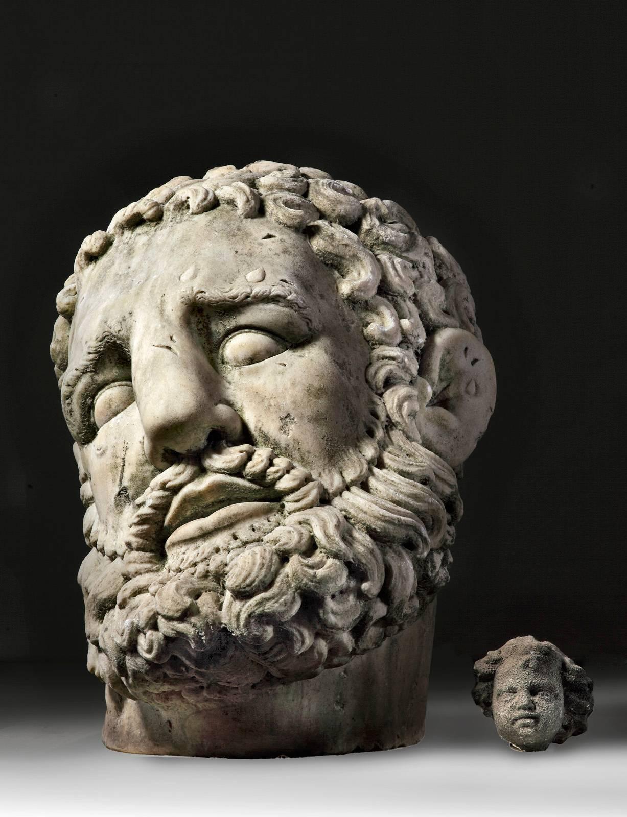 Hercules is portrayed as a bearded man with drops of sweat on his brow.

There are various examples from the ancient world of sculpture executed on a monumental scale, the immense heasd and left foot of the Emperor Constantine, held at the
