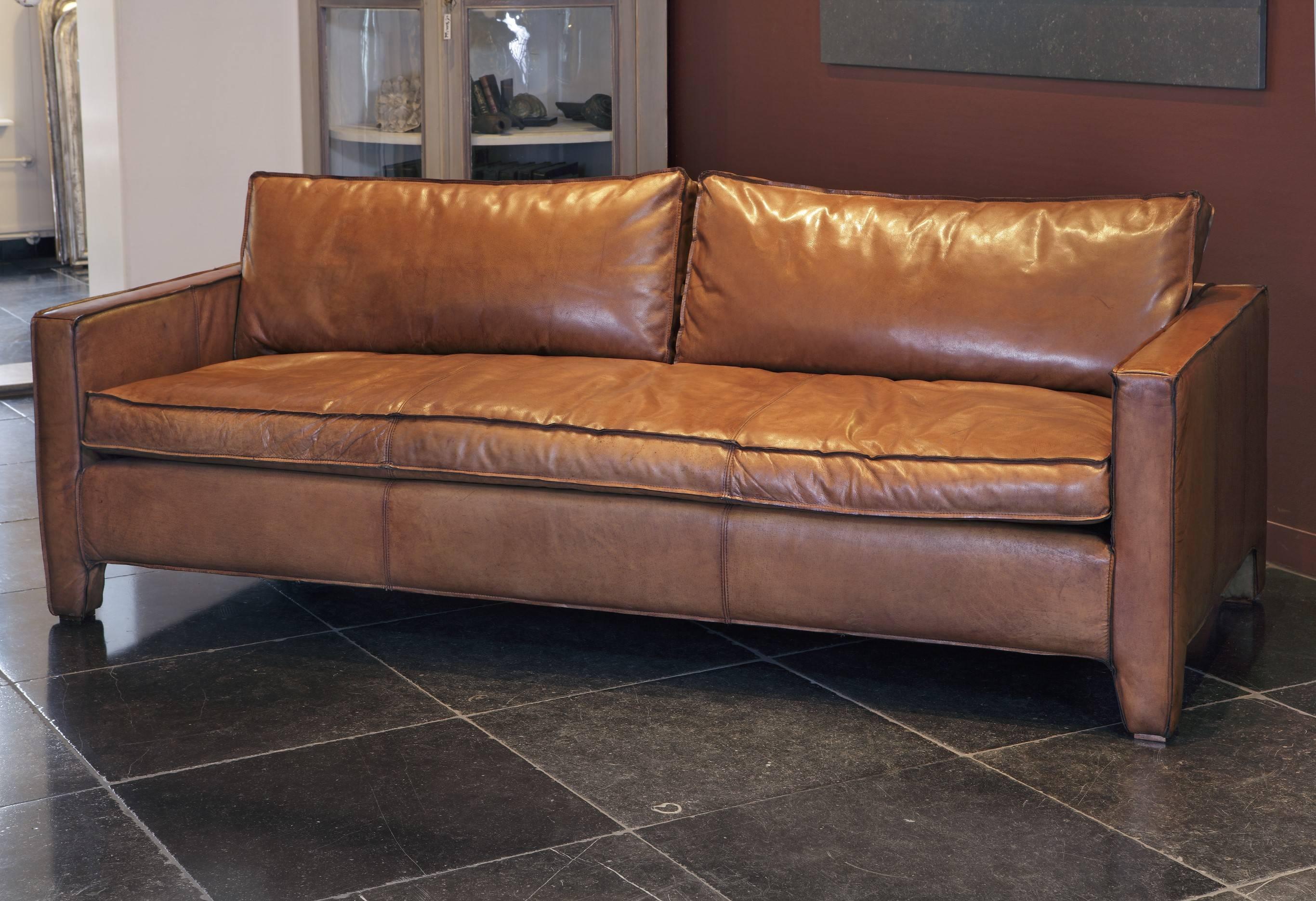 A comfortable, modern and sleek calfskin leather three-seat sofa / couch.

This item is not in stock and has a delivery time of ± 10 weeks. 