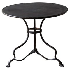 19th-century French Arras cast iron bistro table with claw feet