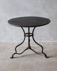 19th-century French Arras cast iron bistro table with claw feet