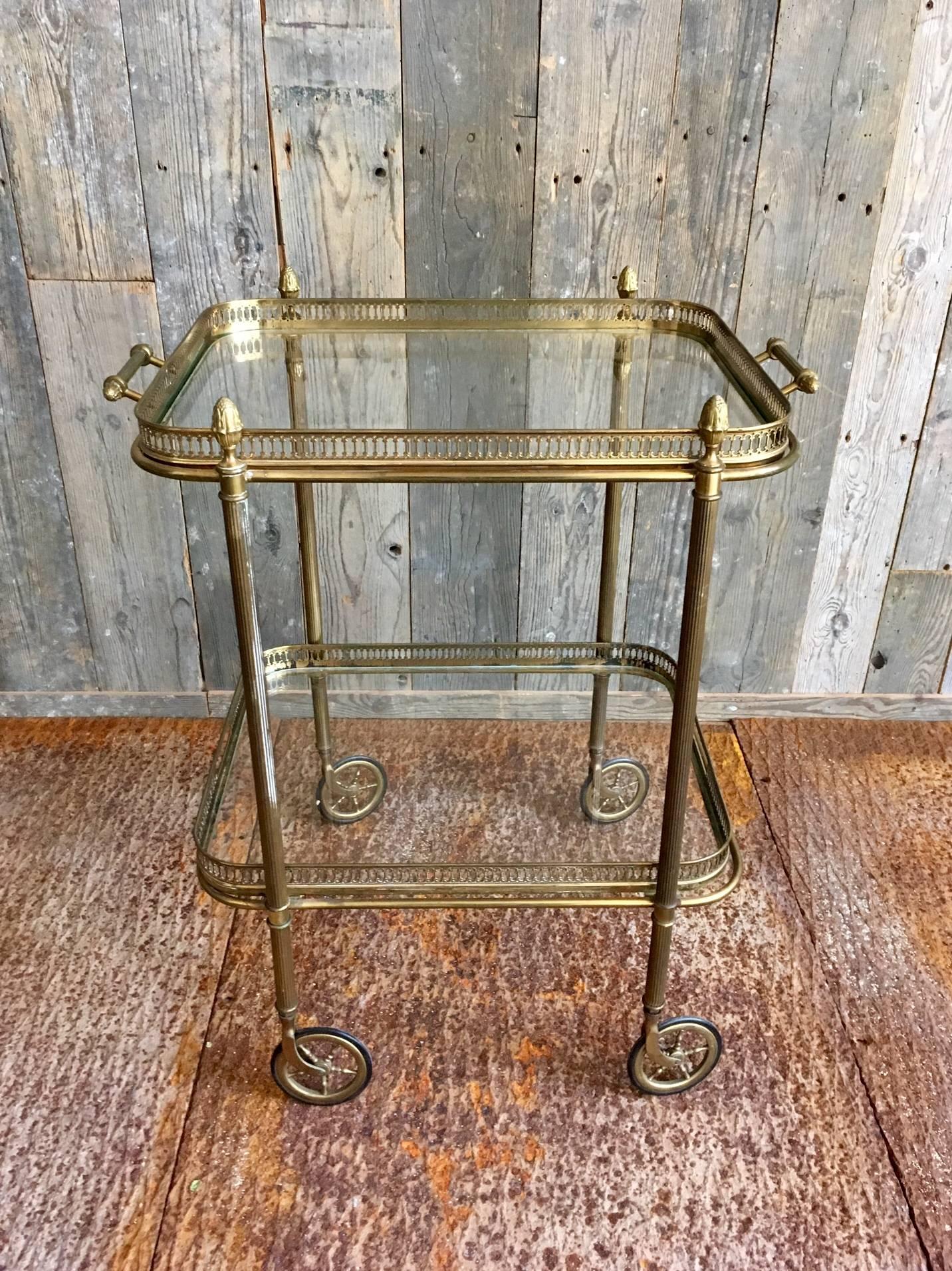 Beautiful serving table in brass and glass. The table can be used as a side table.