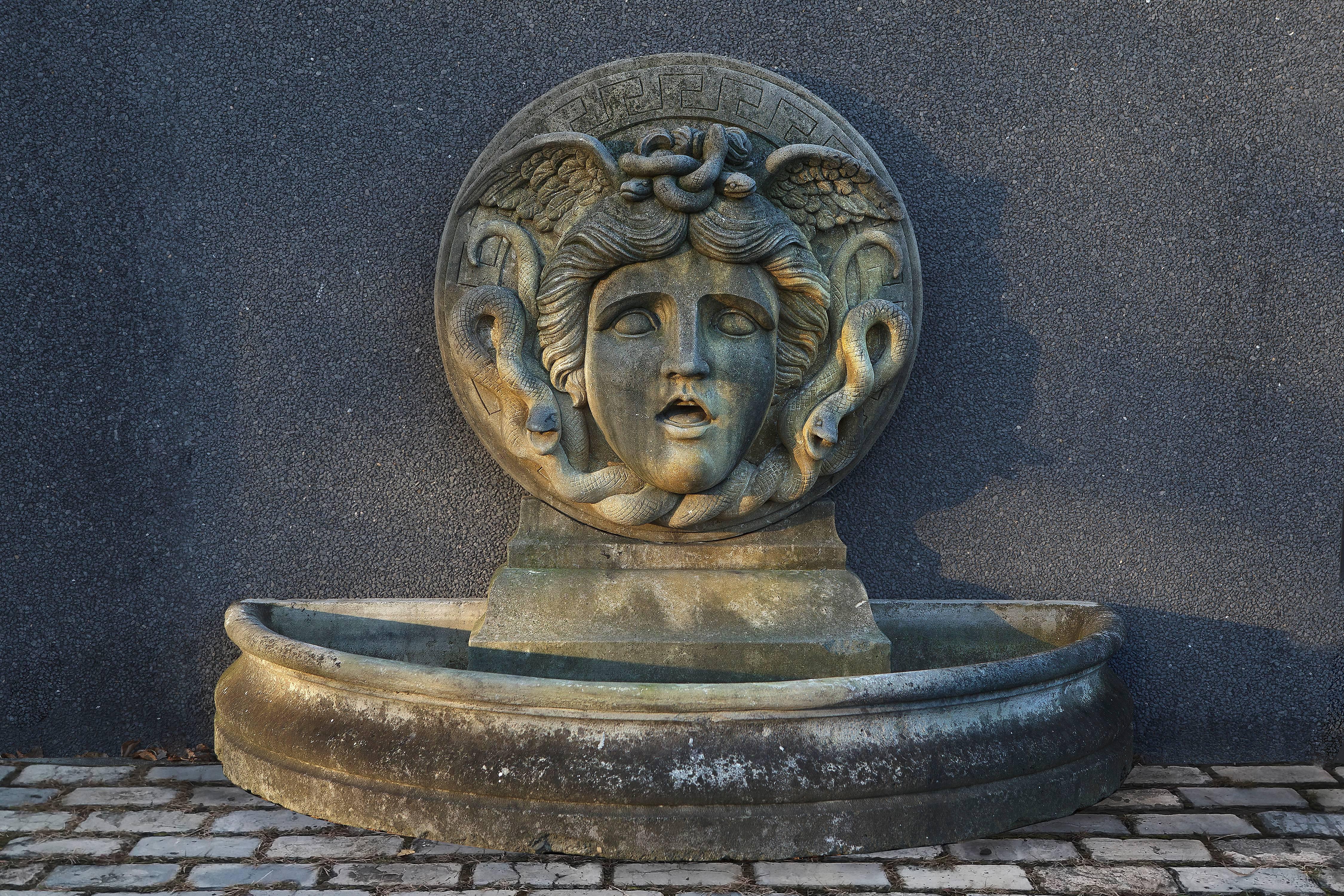 A pair of these very imposing wall fountains were ordered by Gianni Versace for his Miami Beach home, the former Casa Casuarina. One of the pair was delivered, this one was cancelled. 

The fountain has a circular backplate carved in high relief