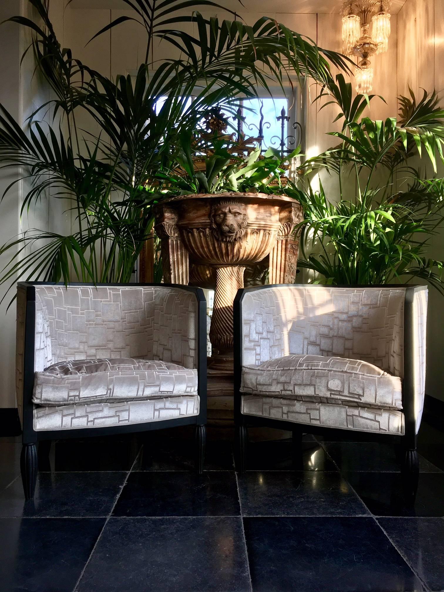 This pair of armchairs was made in the late 1920s in the Art Deco style.
The upholstery has recently been redone with a beautiful champagne/sand colored velvet with an Art Deco relief. The chairs look as if they never have been different. 

The