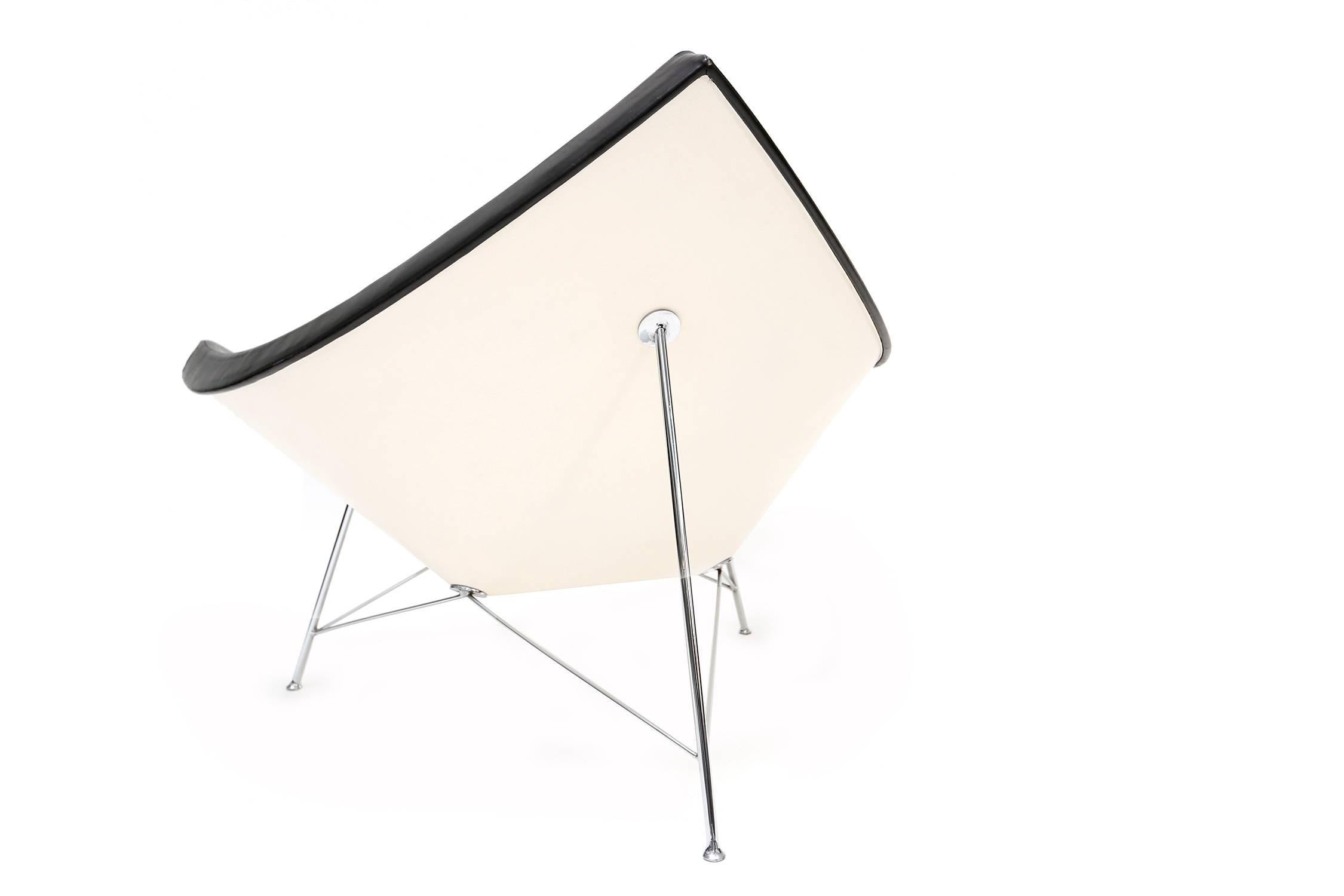 Coconut chairs | Herman Miller.
USA | 1956
black leather | bent-steel three-legged base
84 cm H 107 cm W 81 cm D