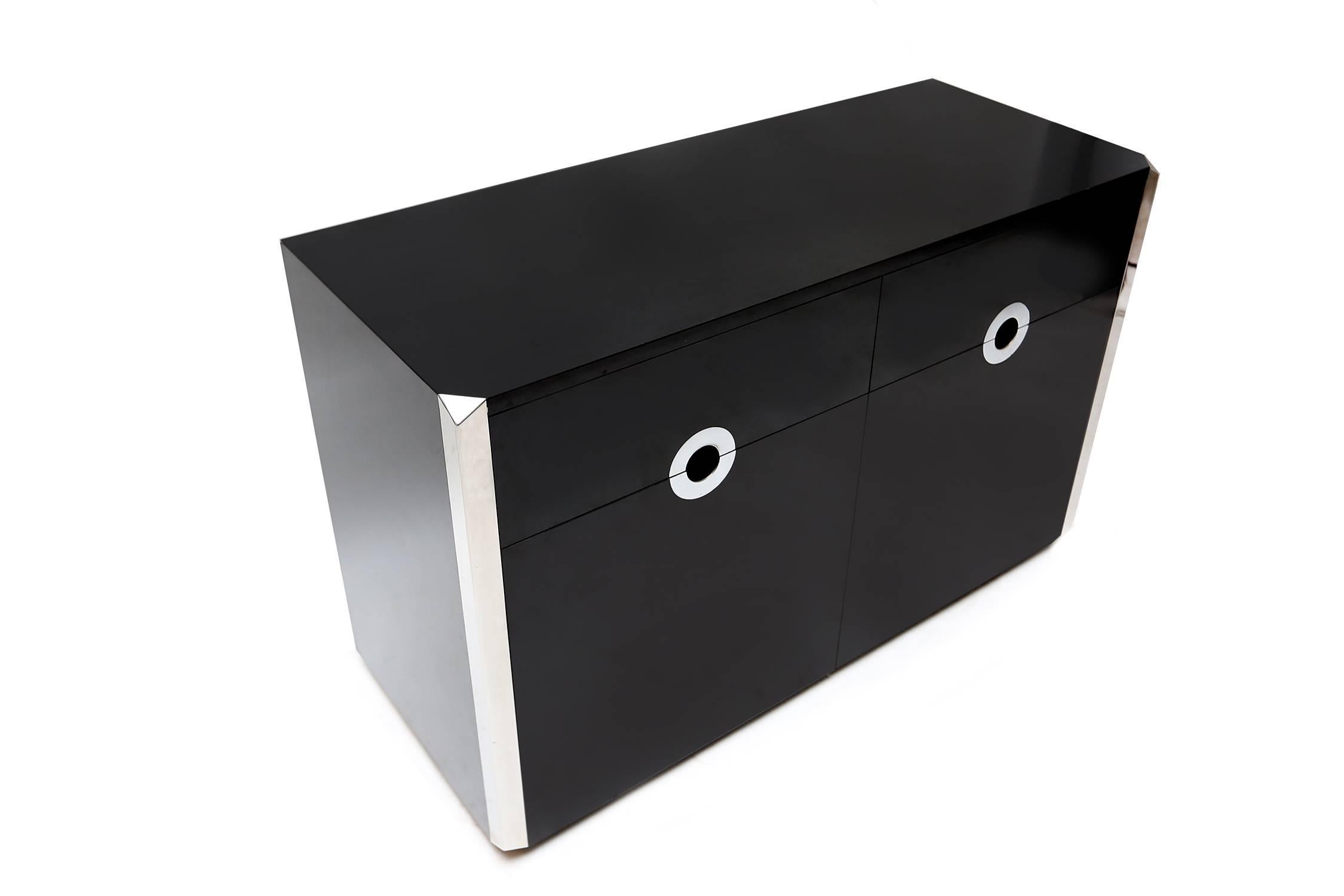 Black lacquer and chrome cabinet.
Designed by Mario Sabot.
Italy, 1972.
Measures: W 120 cm, D 48 cm, H 76 cm.
         