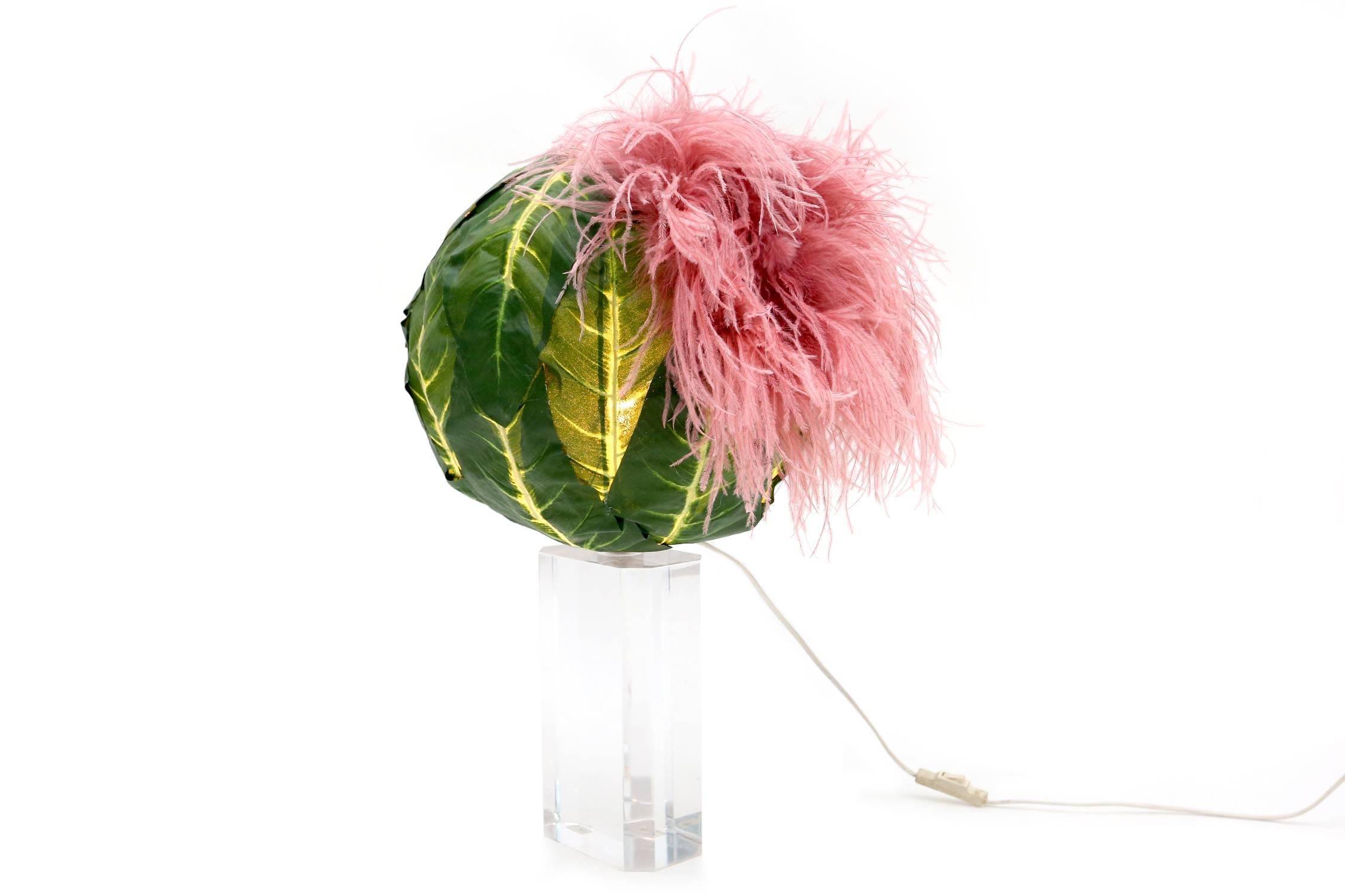 Lucite post-modern table lamp, Italy, 1970s
A Custom designed shade of faux leaves and ostrich feathers make this lamp very fitting to the ugly cool design trend.
Post-Modern circa 1970s
Measures: H 60 Ø 36 cm.
Would fit well in a contemporary