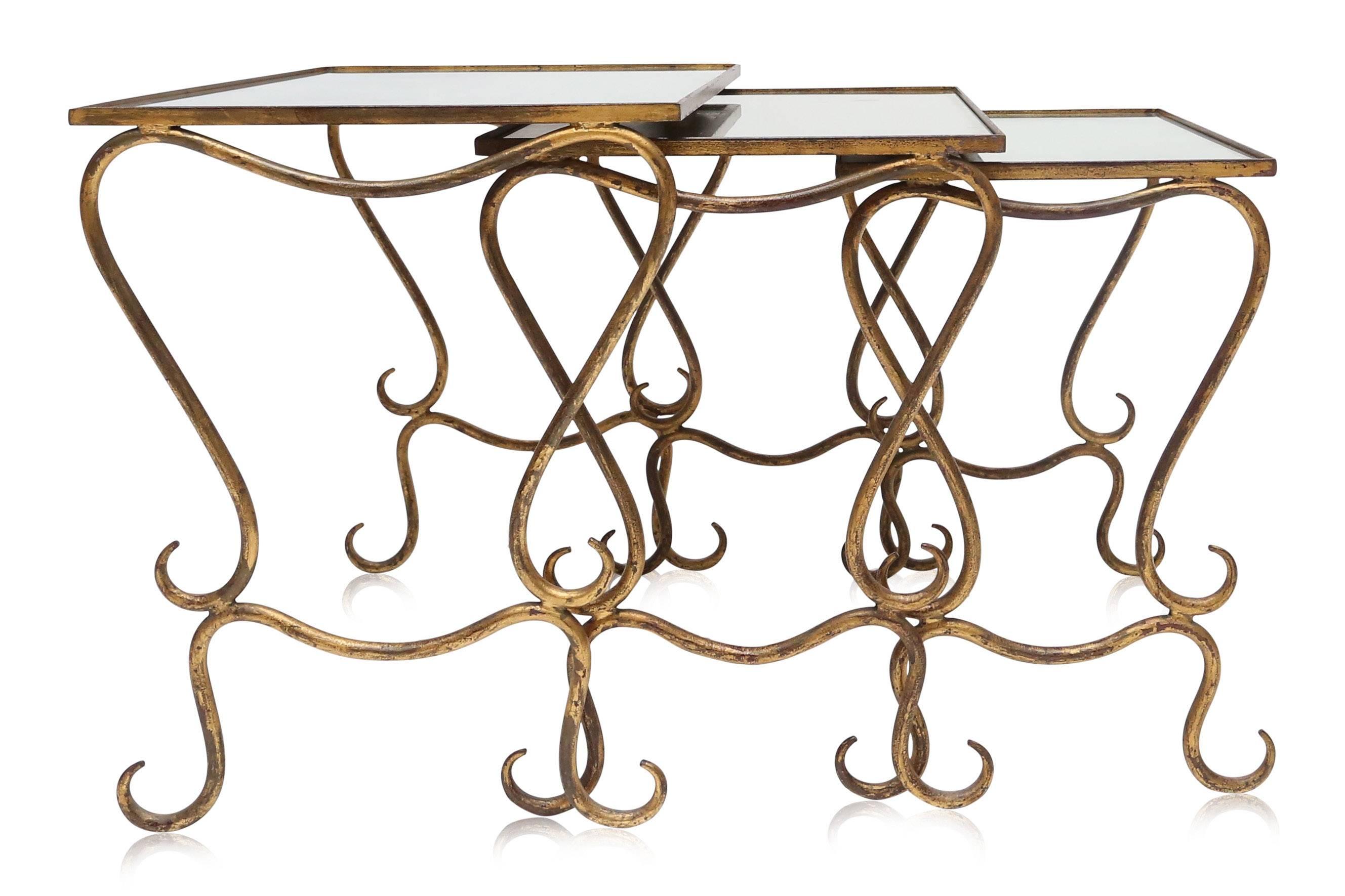 Price on request.
Tables gigognes - nesting tables in gilded wrought iron,
by René Drouet, France, circa 1940.
Beautiful original worn glass tops.
Measures: L 55 cm, D 40 cm, H 48 mc.
   