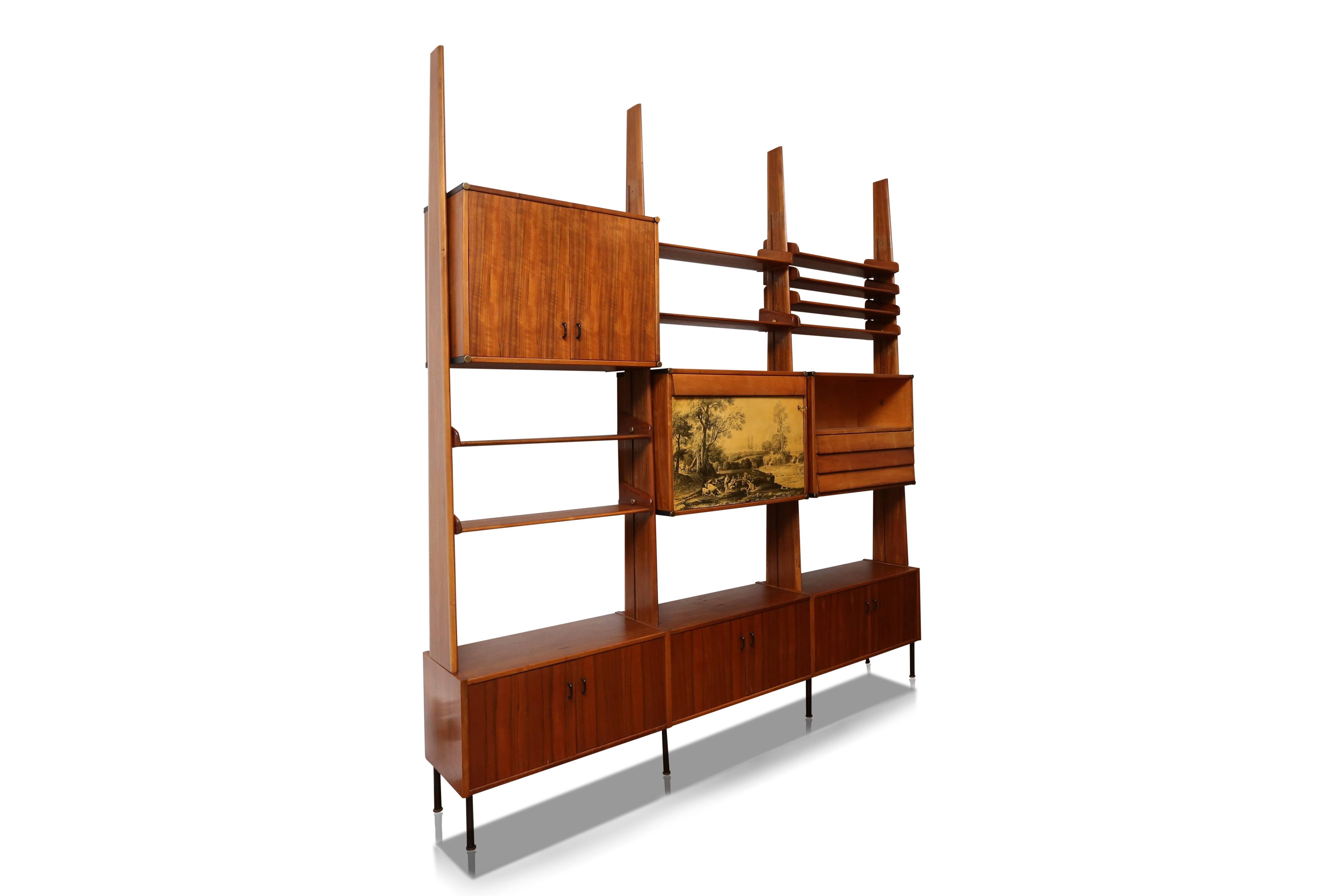 Italian wall console with shelving system.
Attributed to Franco Albini,
Italy, 1950s.
Walnut, brass.
Measures: L 250 cm, H 277 cm, D 42 cm.
three more shelves included.