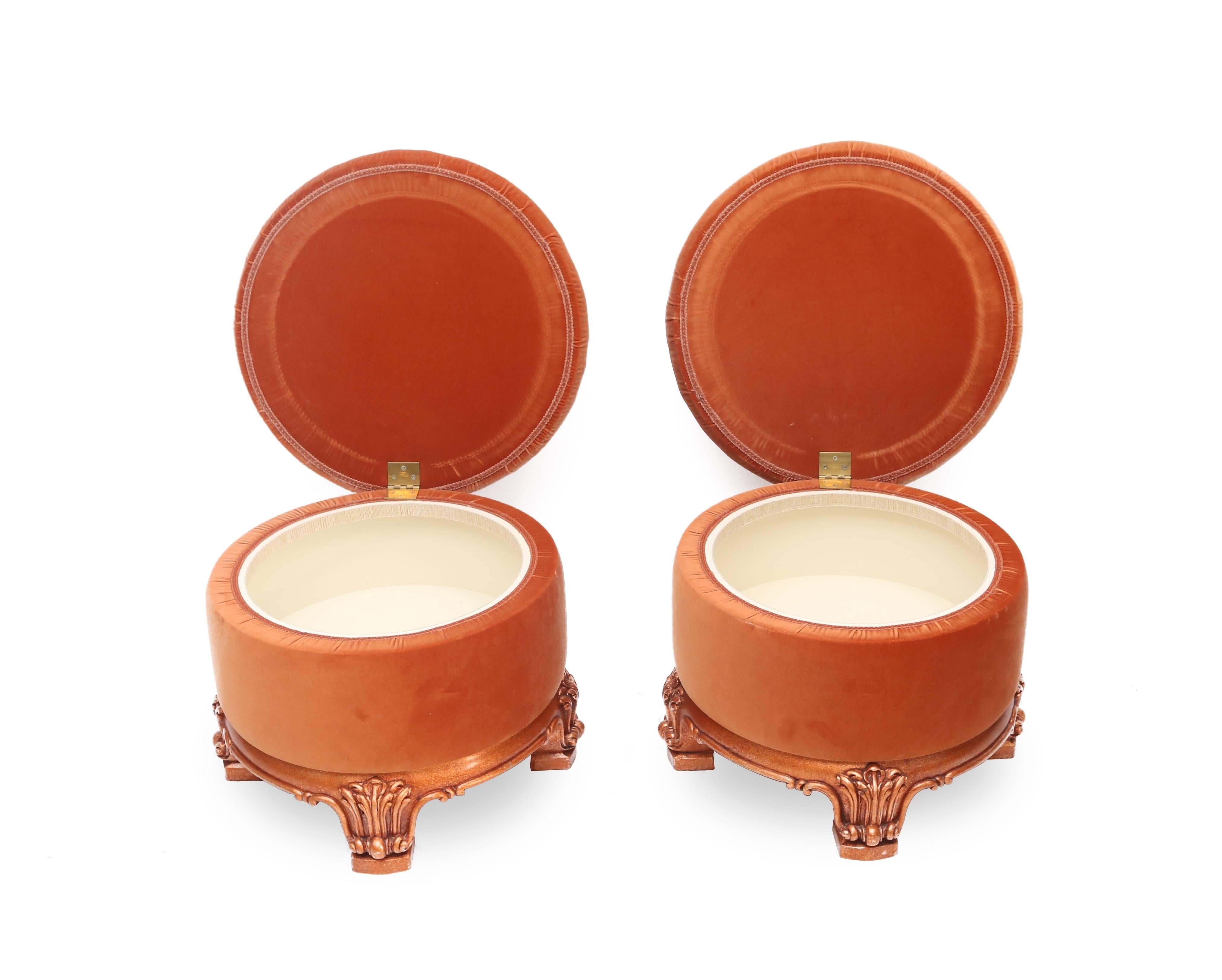 Coral colored Hollywood Regency style Ottomans, with hidden storage compartment.

Carved shiny copper lacquered wooden base.

Custom designed in the 1980s by a Dutch architect.
Measures: Ø 55 cm, H 43 cm.