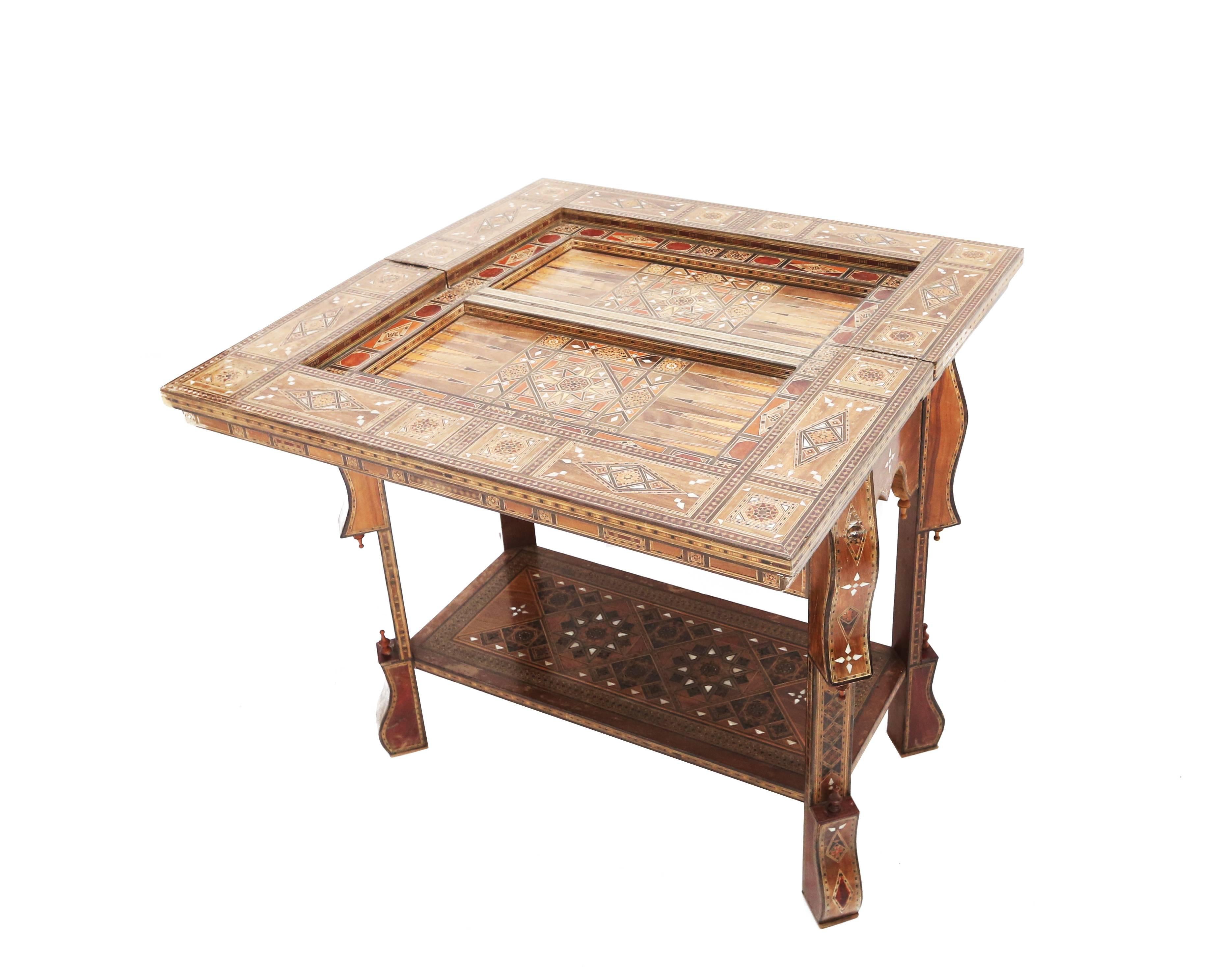 Oriental Syrian transformable gaming table, for backgammon, cards and chess.

Multiple fruitwood inlay, mother-of-pearl, 

Syria, 1930s.

