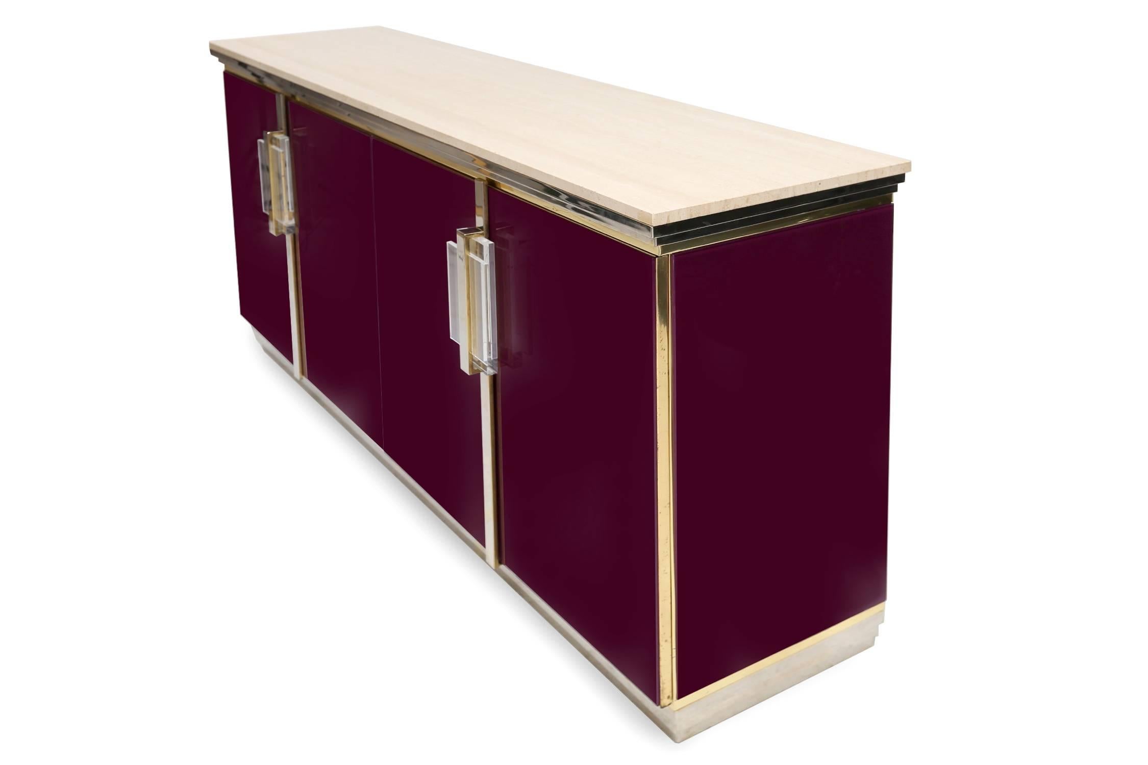 Magnificent sideboard from the 1970s.
Maison Jansen, France.

Brass, perspex, hyalith glass, travertine top and black laminate shelving inside.

Measures: L 188 cm H 90 cm D 50 cm.

  
