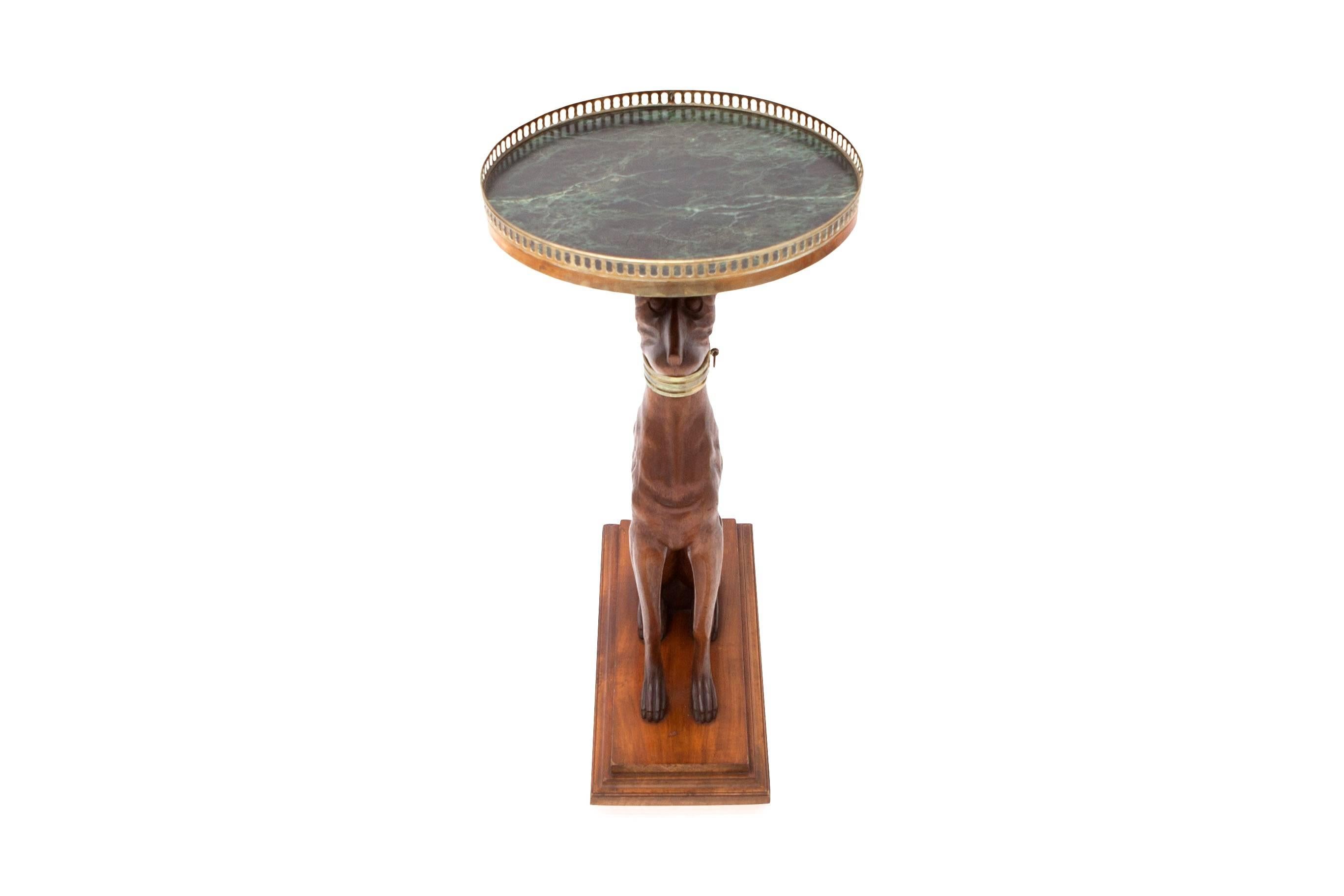Hollywood Regency side table.
Solid wood greyhound sculpture.
Mounted on walnut base.
Faux marble painted top with a brass rim.
Very elegant and chique model.
USA, 1970s.