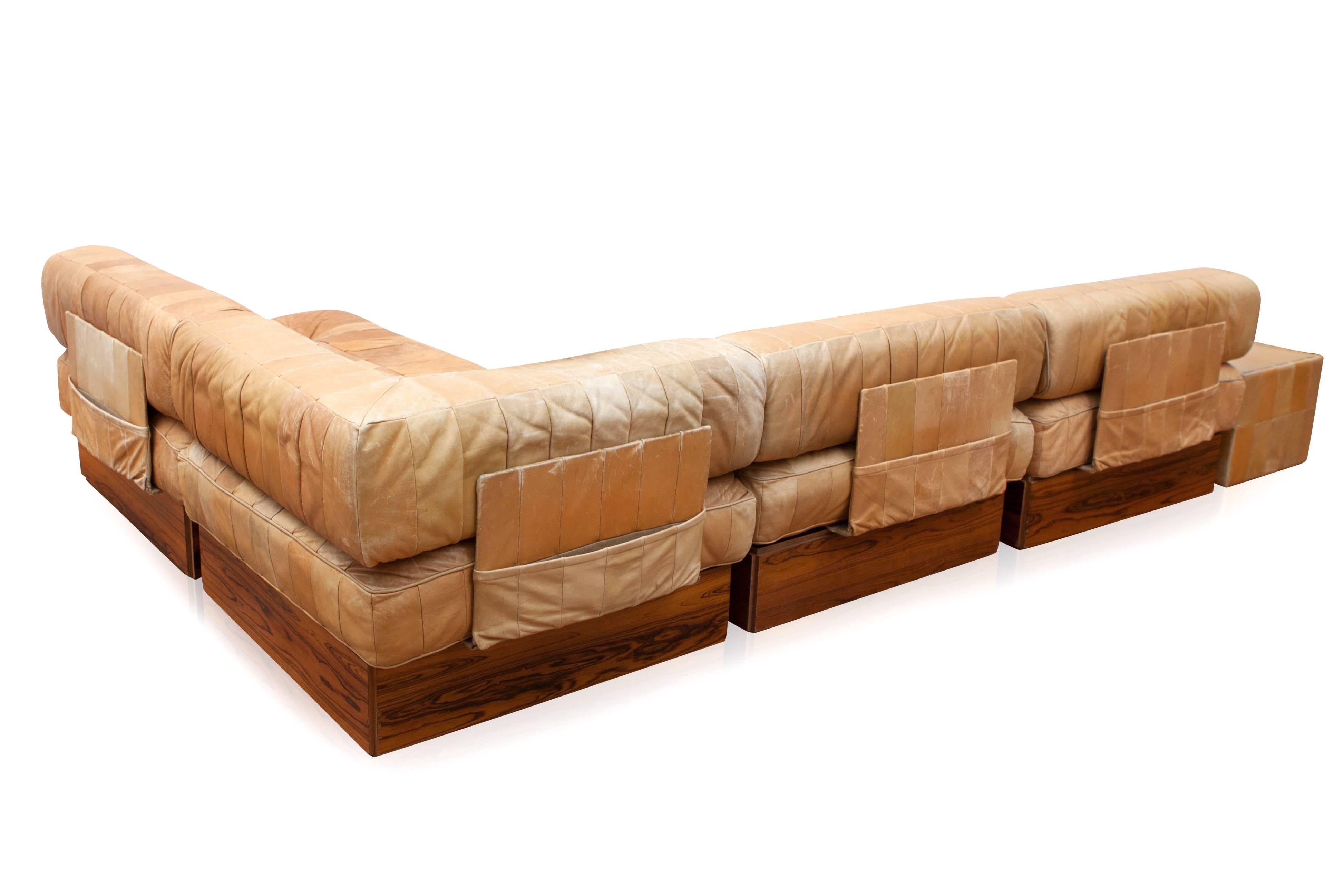 Sofa, DS 88, caramel brown patinated patchwork leather, 1970s.
This comfortable leather sectional sofa is manufactured 
by De Sede in Switzerland.

This sofa consists of 12 seating elements, four regular back cushions,
one double size back