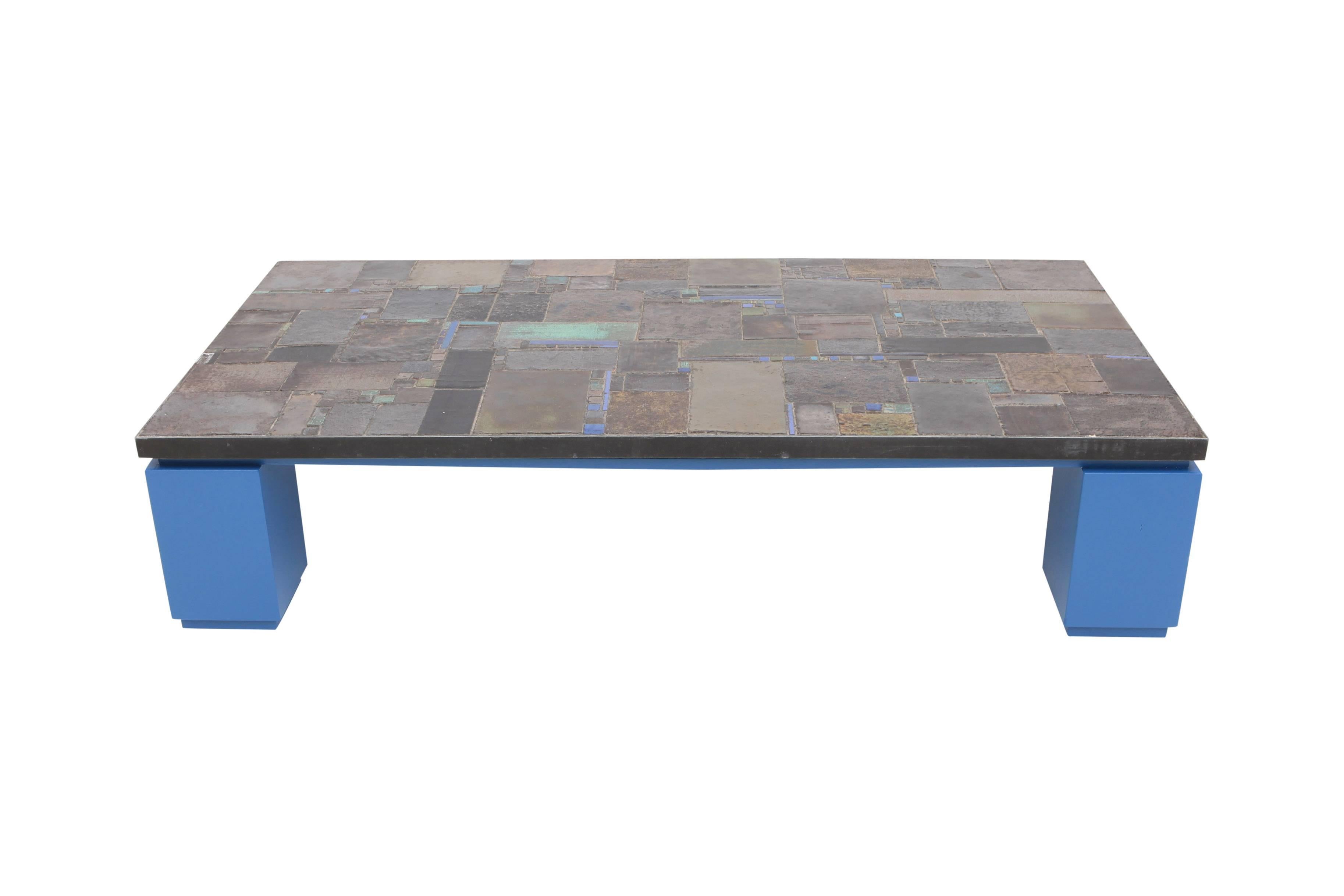 Mid-Century Modern Rectangular ceramic tile coffee table by Pia Manu mounted on antique blue lacquered base

One of the colors and glazes used in the tabletop hints to the use of color in the base which makes it a very fresh and high-end looking