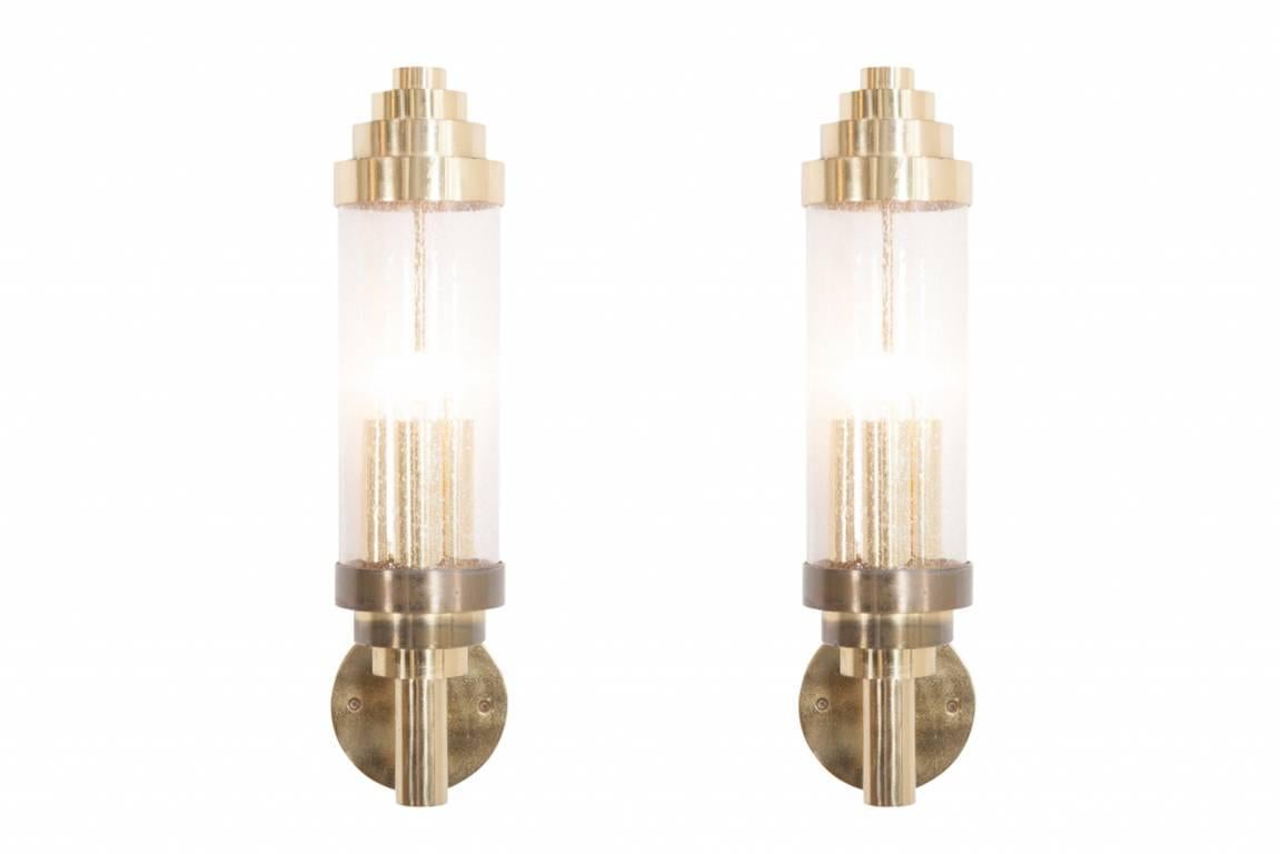 Brass Cylindrical shaped, handblown glass sconces, Italy, 1960s

Each scone is provided with three-lightbulbs which spread the light beautifully.
The lights can be mounted both ways, up/down depending on the interior. 

Would fit well in an eclectic