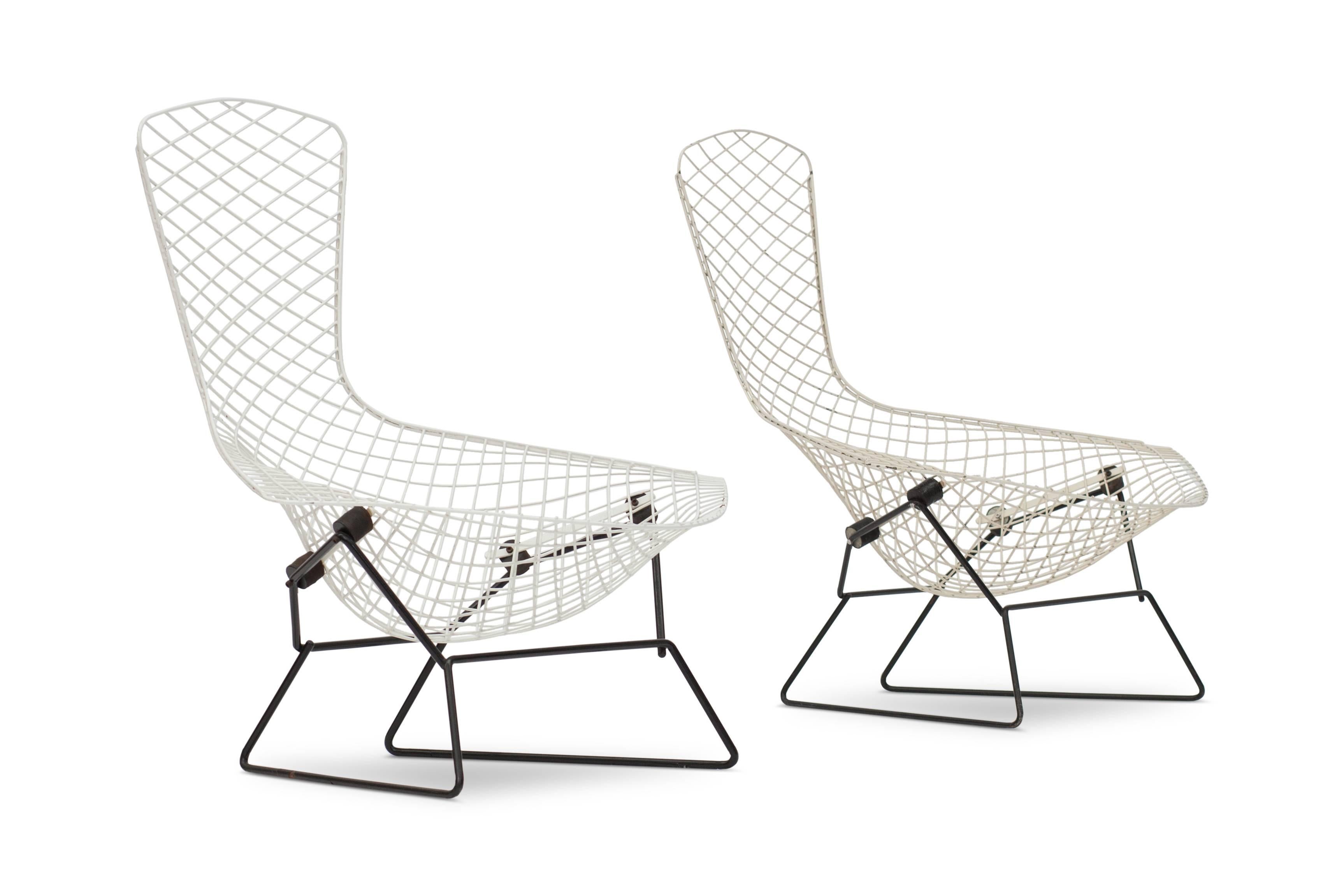 Pair of Harry Bertoia bird chairs for Knoll International.

White wired seating frame on black base.

USA, 1960s edition.

The Bird chair is an astounding study in space, form and function by one of the master sculptors of the last century.