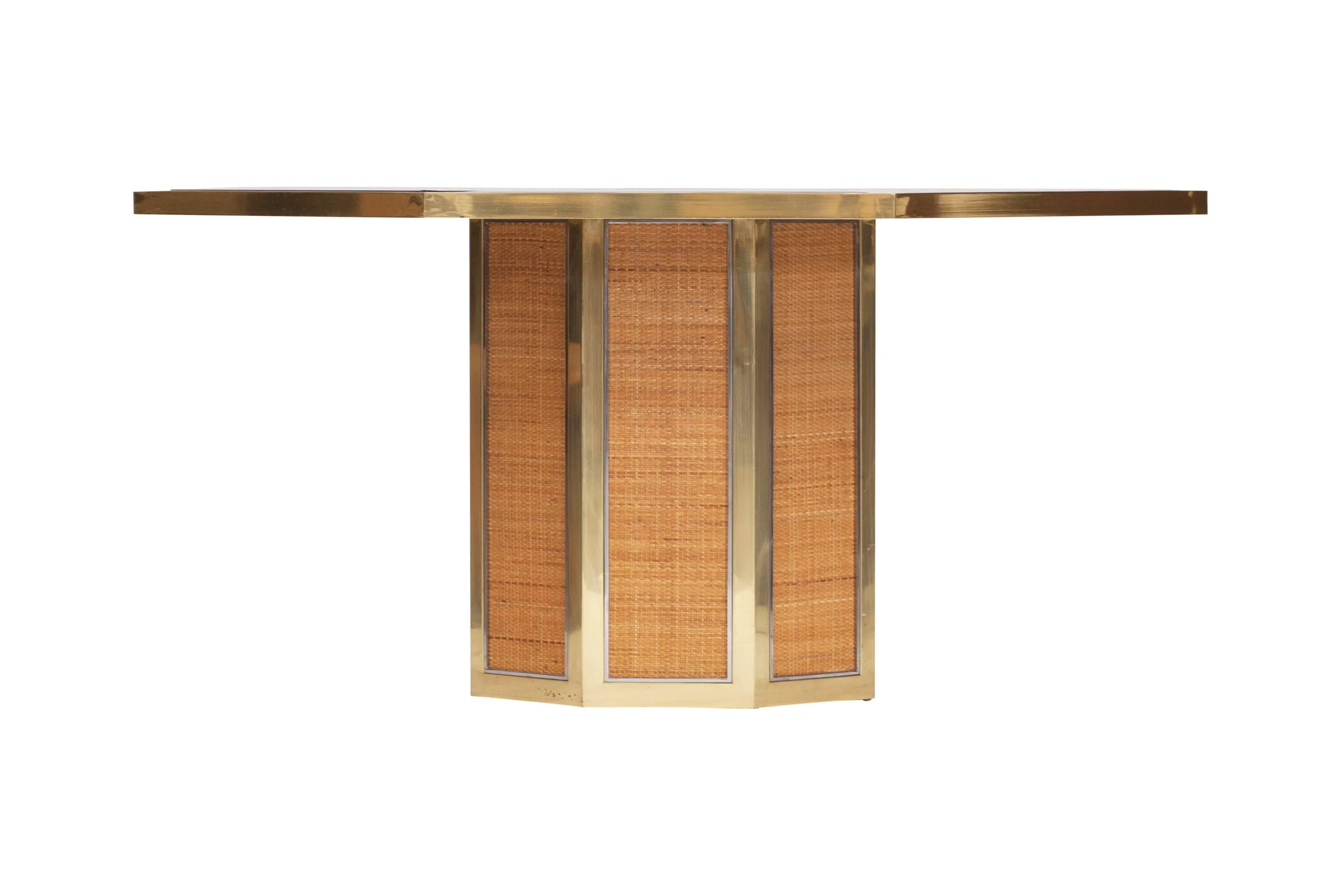 Chique octagonal dining table by Romeo Rega.

1970s, Italy.

Brass. Smoked glass. wicker

This makes an extraordinary set with the matching dining chairs in our other listing.

Measures: Ø 163 cm, H 73 cm.
 