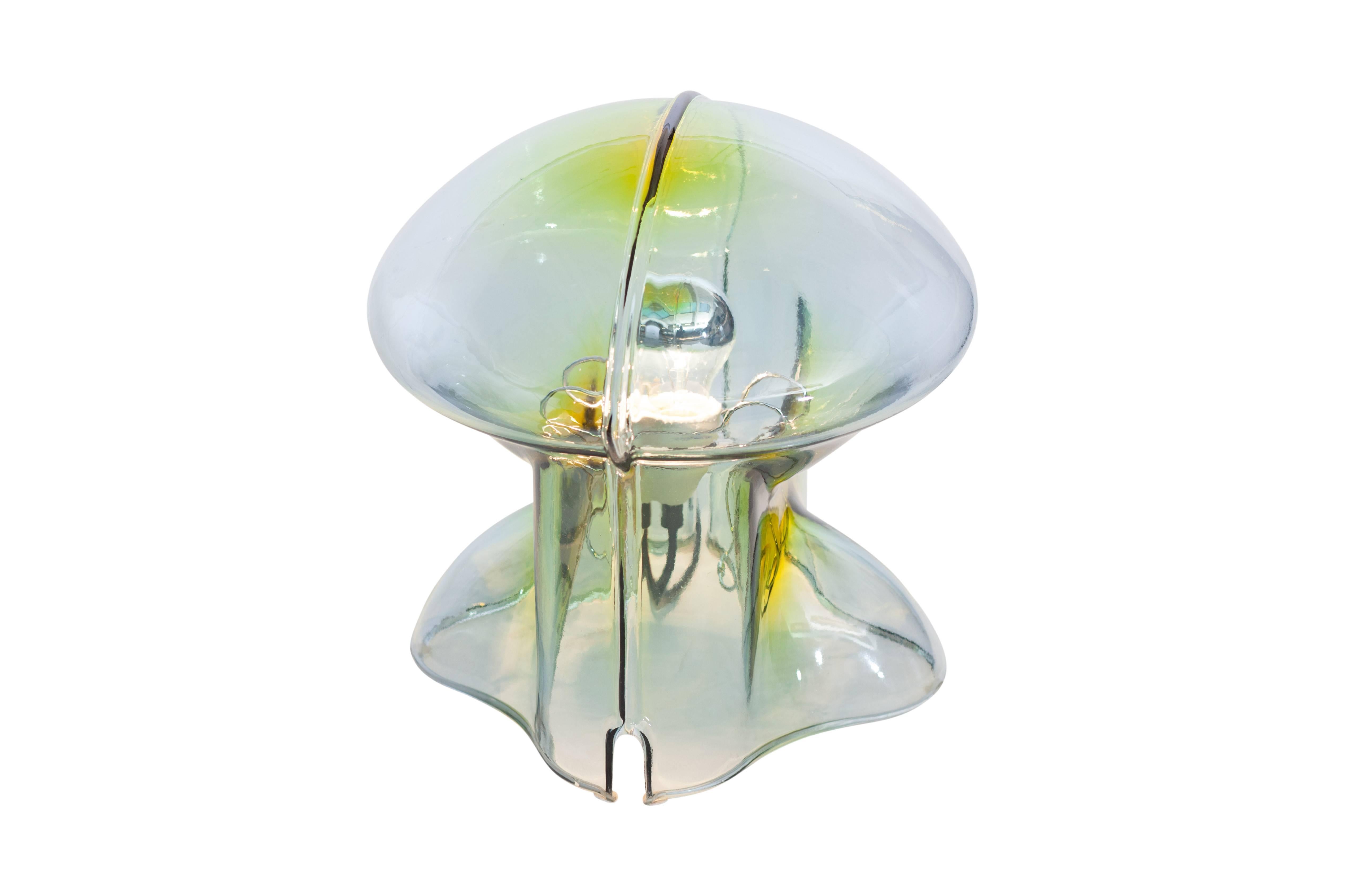 Italian mouth blown glass table lamp by Umberto Riva for VeArt, 1970s
The lamp is made out of petroleum colored glass, which creates a stunning light effect.

We could send you a video to have a better idea of color.


       