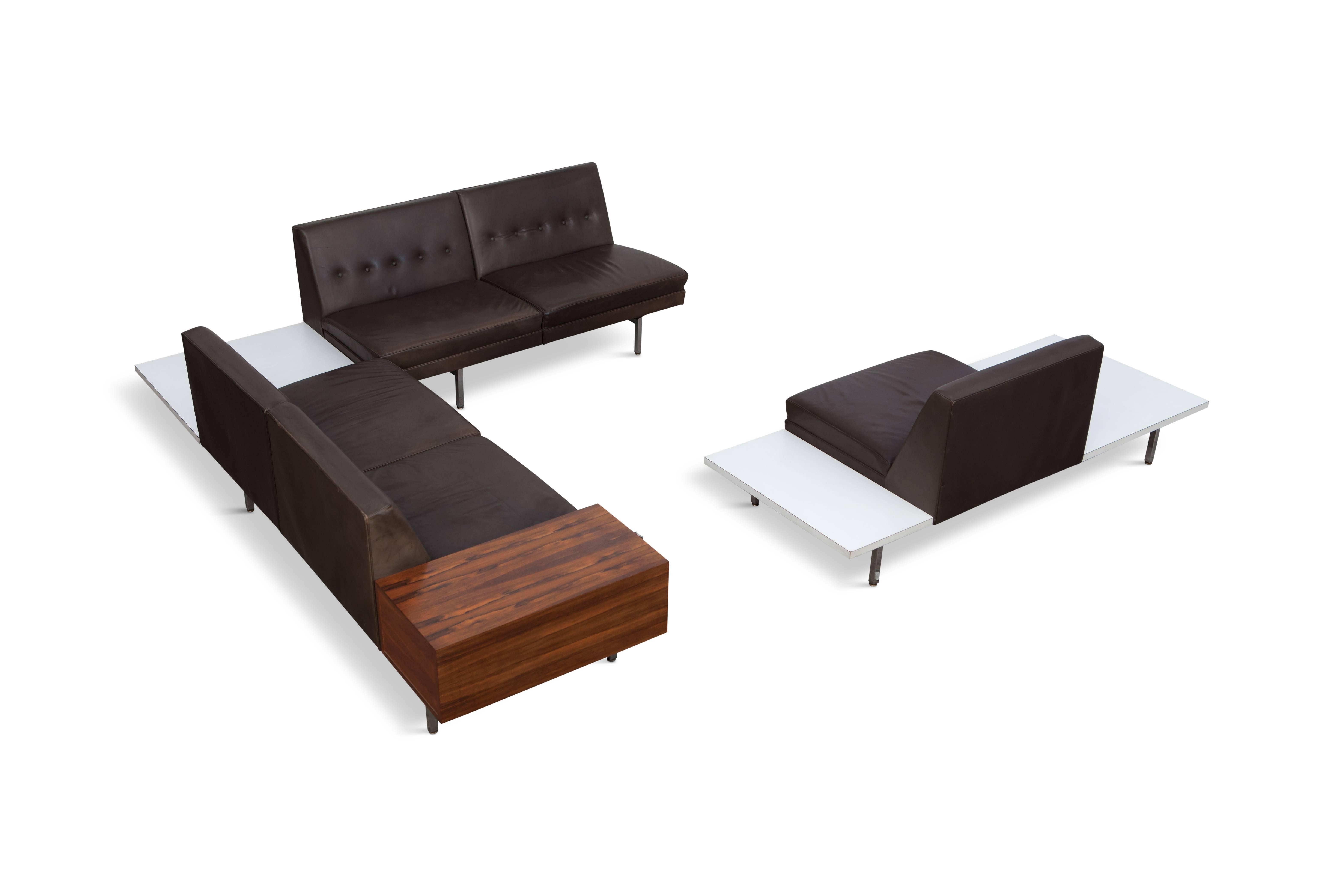 Magnificent modular system sofa designed by US George Nelson in the 1950s
for Herman Miller

Dark brown leather seating of the best possible quality is used, mounted on a typical chromed steel adjustable frame. Three white laminate tables and a