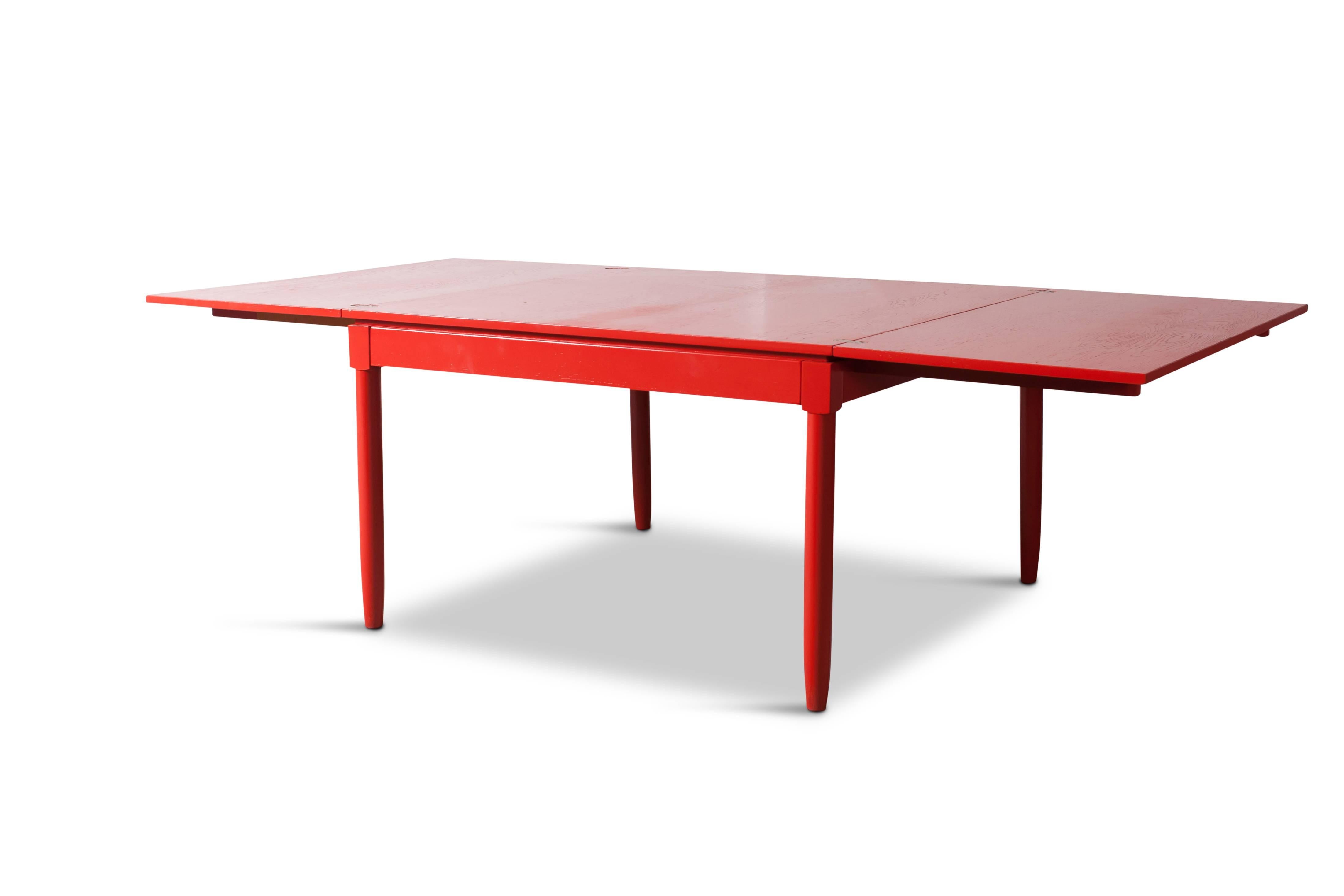 Red Lacquered extendable Dining table
by Vico Magistretti for Cassina

A true iconic design with a simple and elegant shape 

Red lacquered wood and decorative brass hinges 

We have a matching set of dining chairs available

Italy, 1960's

W 244,5