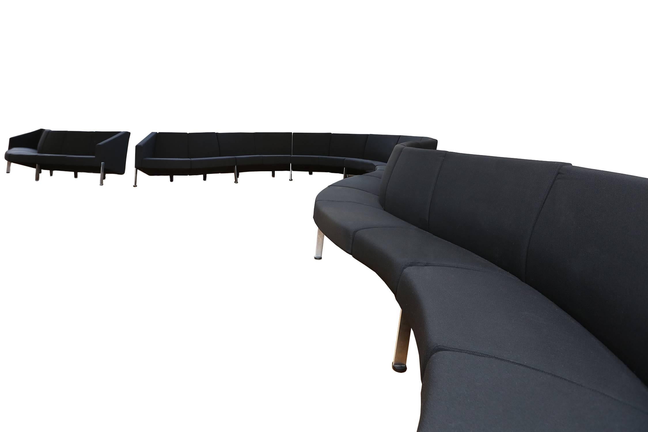 Post-modern sofa 
30 modular elements in black fabric, matte chromed steel.
Fritz Hansen, decision, 1986.

Six ends are available so we are able to divide in three sofas.
16 inwards elements, 12 outwards elements, four straight elements 

Dimension