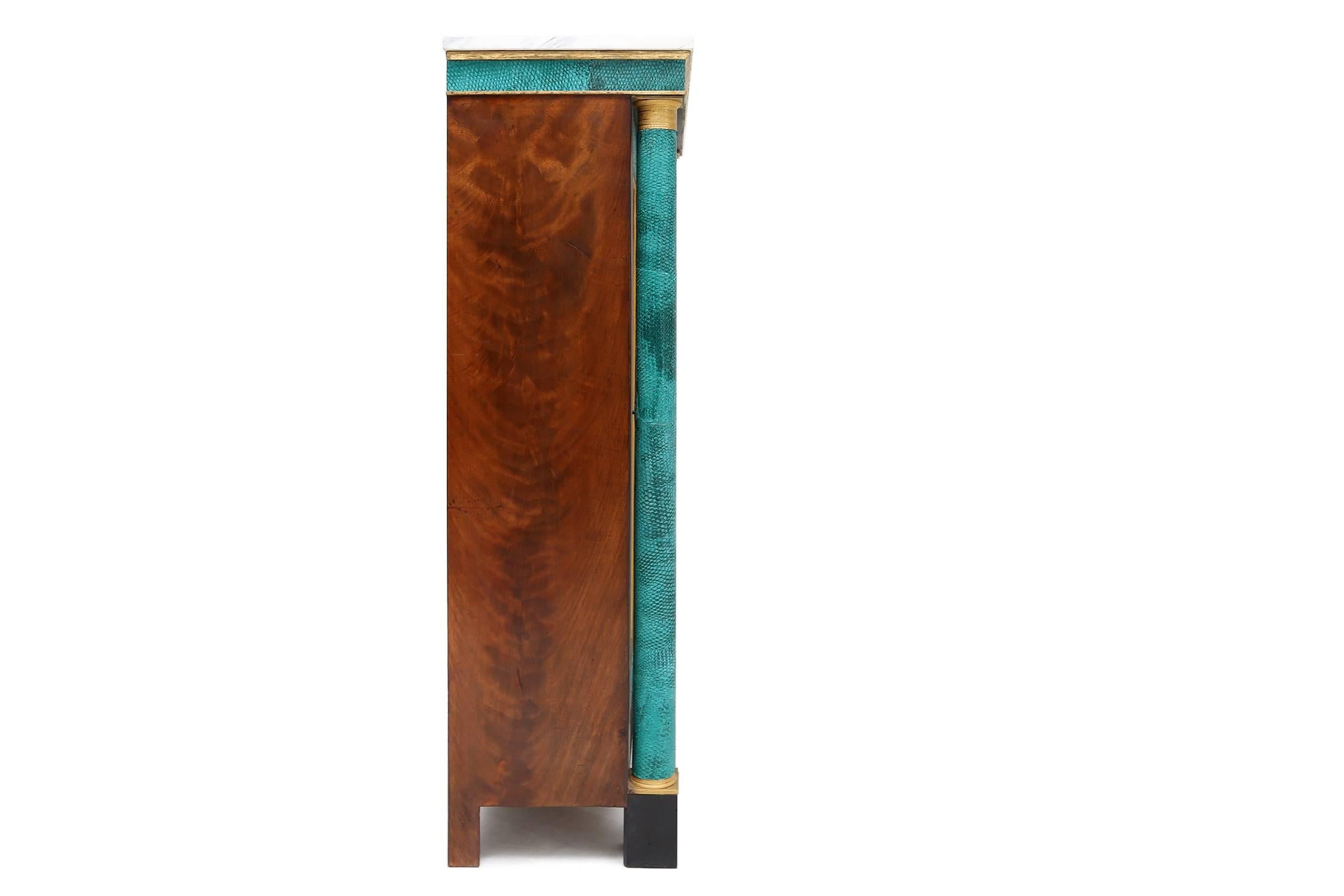 Post-modern Extraordinary turquoise leather covered cabinet.
With a Carrara marble top and walnut and brass details. 

circa 1960s. 

Measures: L 68 cm, H 136 cm, D 38 cm.