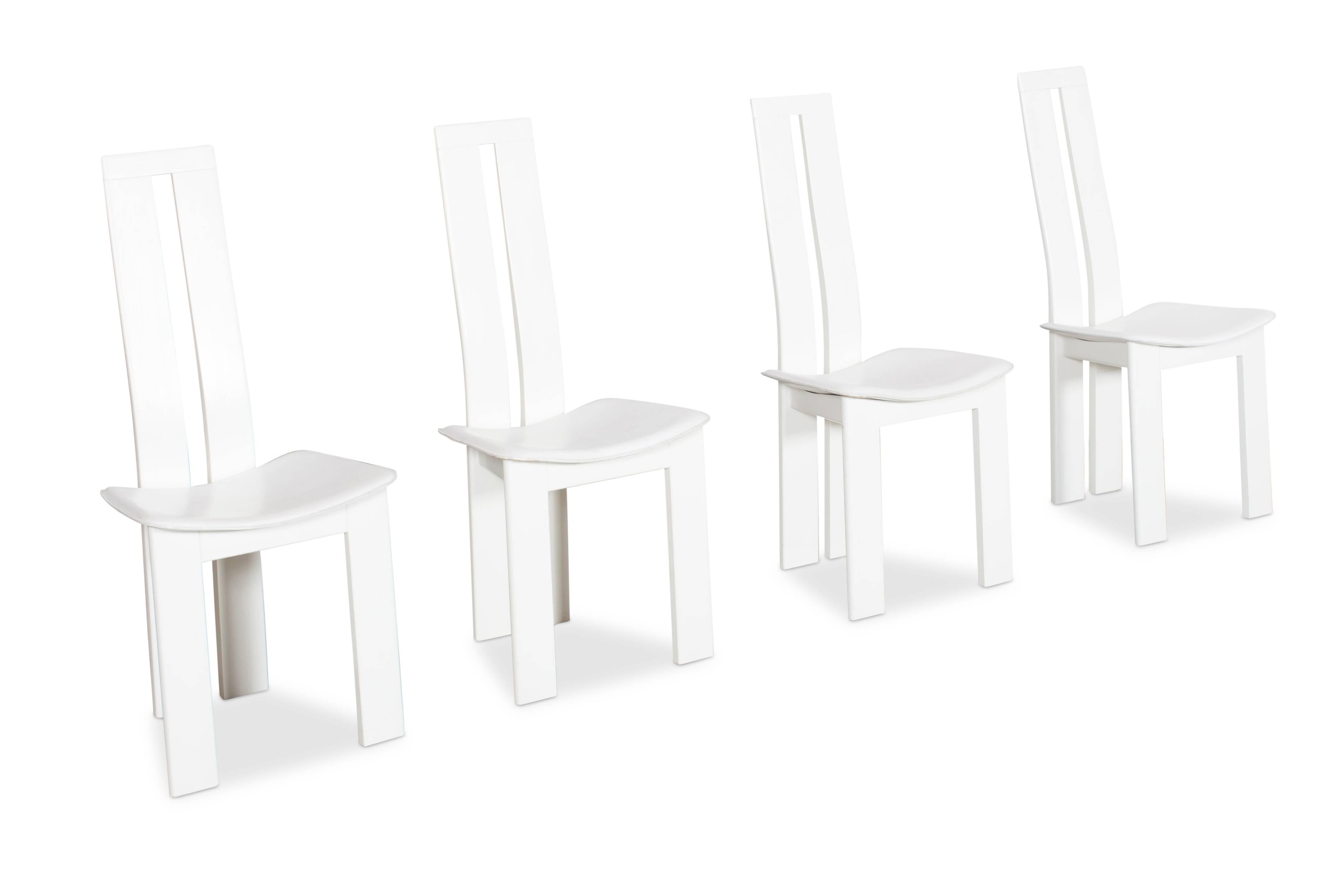 four white leather dining chairs by Pietro Costantini.

Italy, 1970s. 

Wooden base with white saddle leather seating. 
Wood, leather and stitching in amazing condition. 

Marked by the designer.






