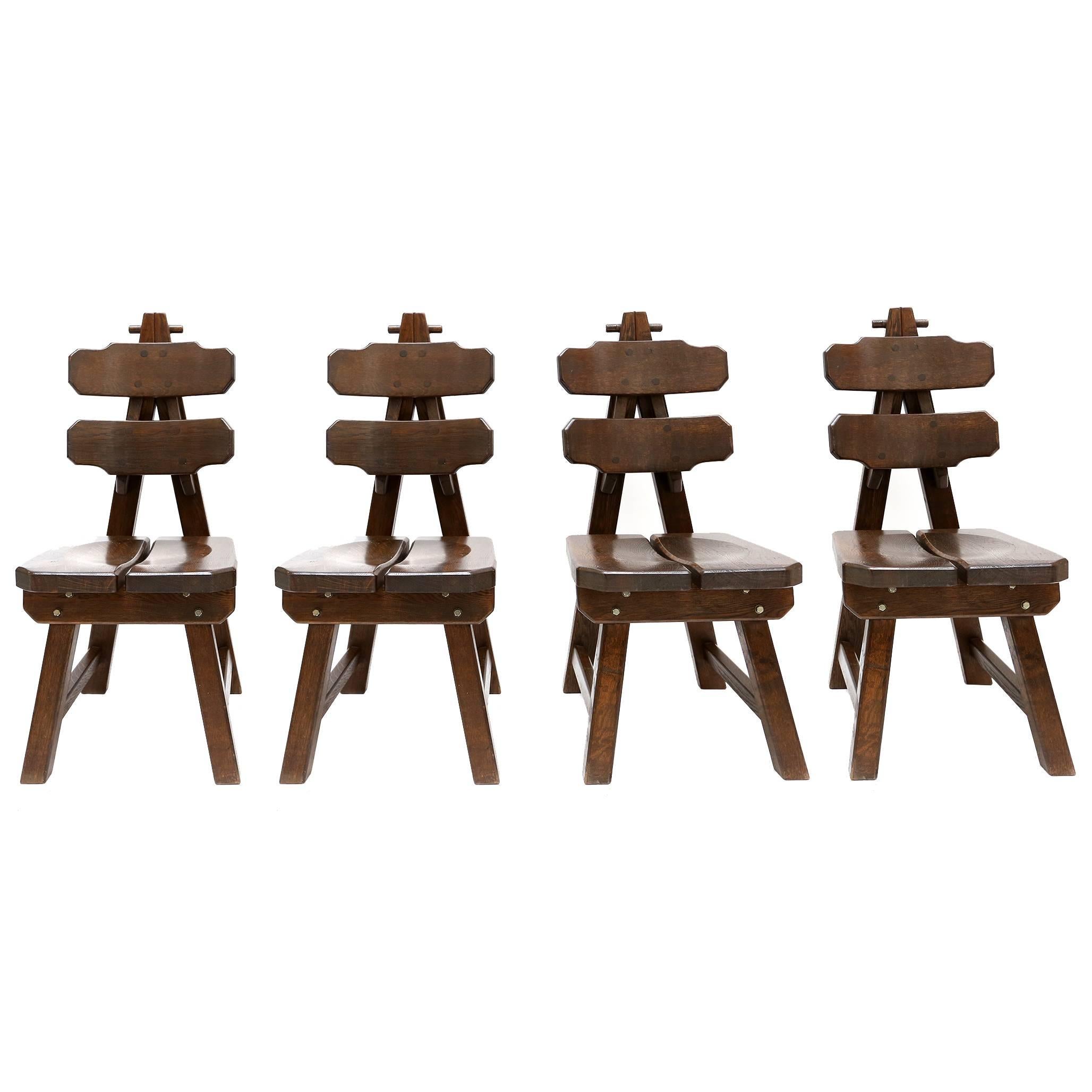 Impressive set of four stained oak chairs.
Very sculptural and geometrical,
Spain, circa 1960.


Measure: H 103 cm, W 44 cm, D 56 cm.