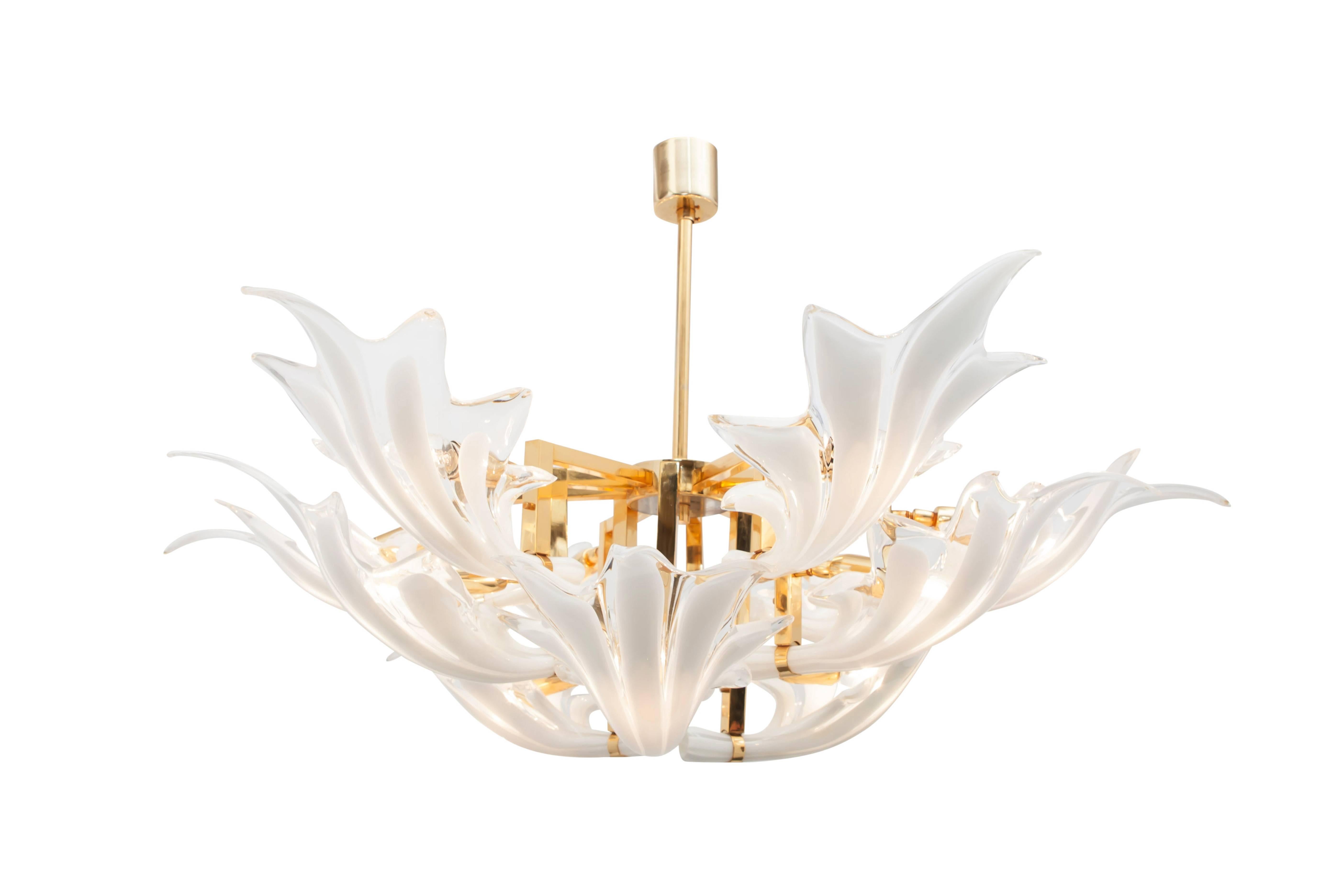 Brass chandelier, rare and superb produced lightning piece with organic glass flower shaped leaves.

Excellent condition.

Murano, Italy, 1970s.

Measures: Ø 95 cm H 40 cm.