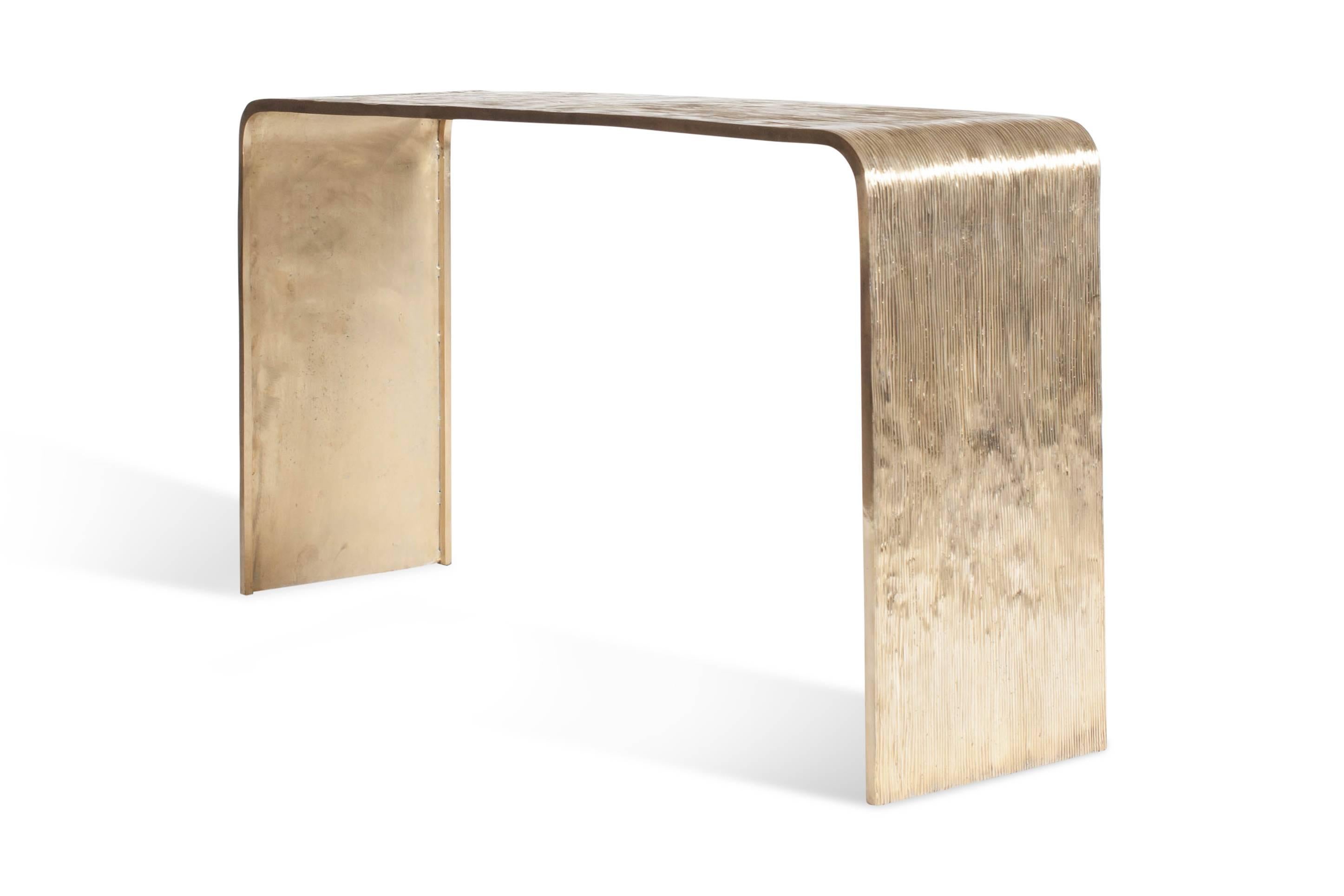 Bronze hand casted console table
A thin and irregular striped pattern give this piece a tactile and high end look
Luxury bronze decorative piece that can be used as a console table or desk.
Our studio designed these pieces as we see them as a