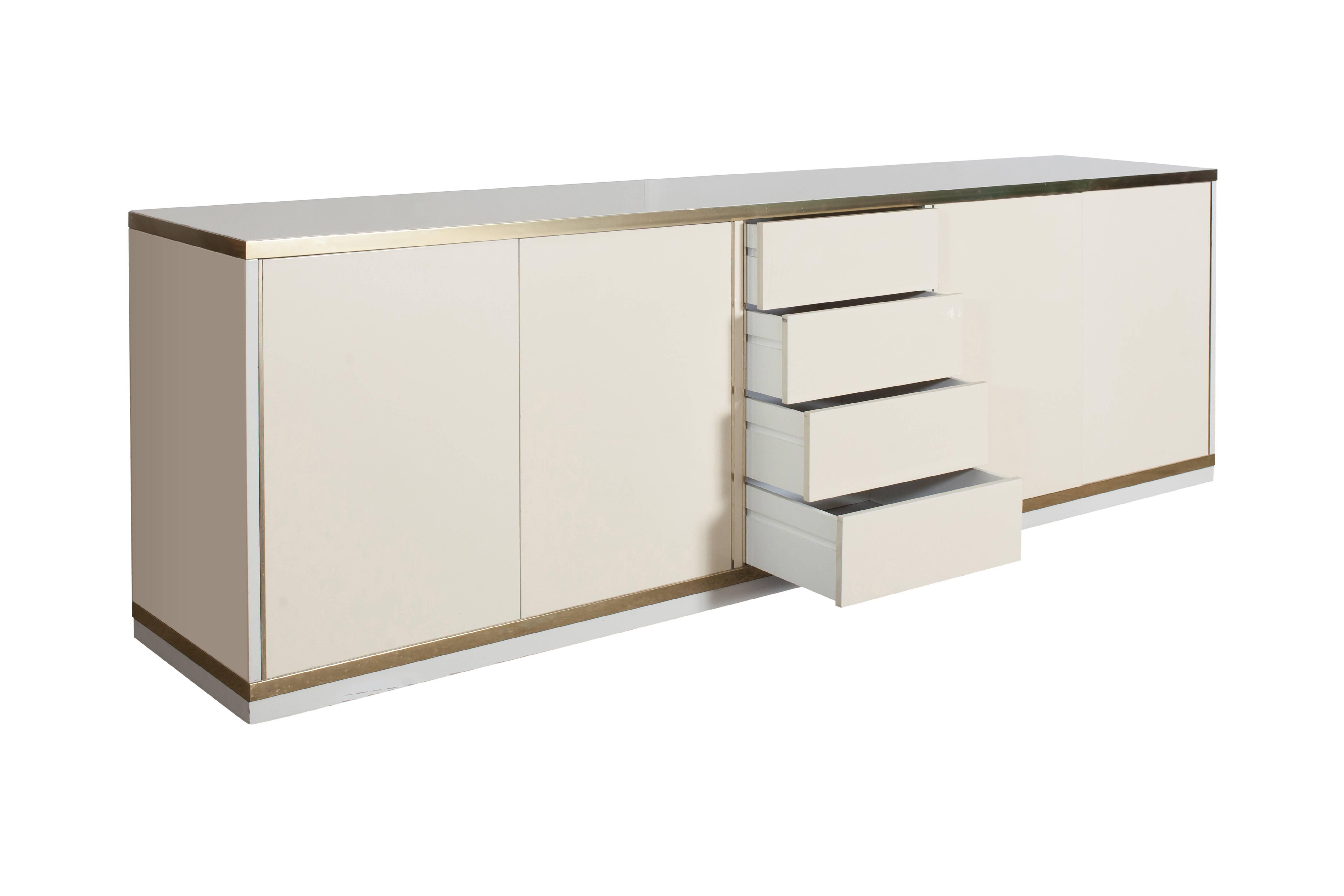 Willy Rizzo style Minimalist Mid-Century Modern sideboard by Mario Sabot, Italy, 1980s
two-tone white lacquer piece with brass details. The credenza is finished front to back so can be used as center piece in the middle of a room.