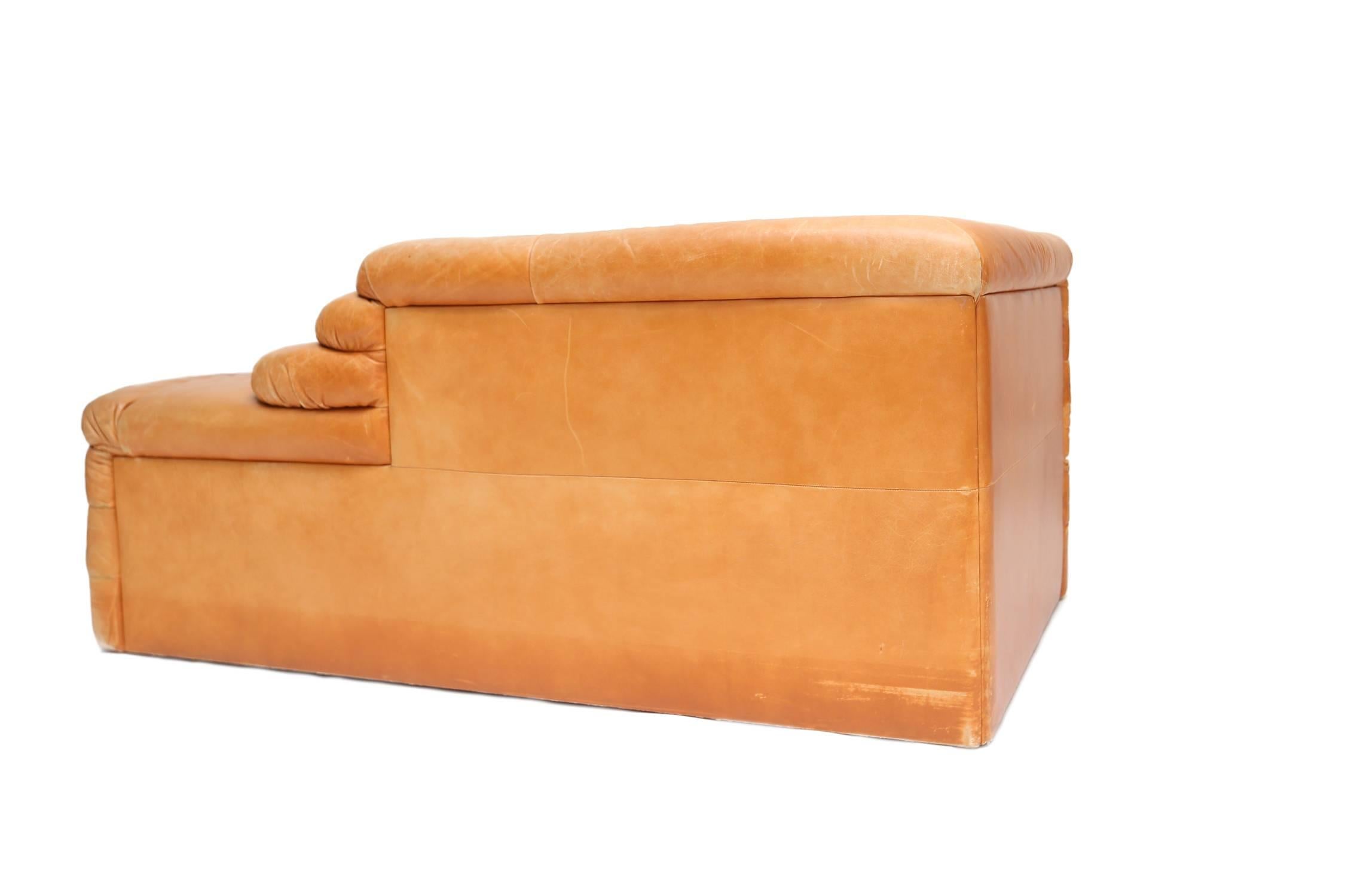 Cognac leather seating element, model Terrazza
designed by Ubald Klug for De Sede,
Switzerland, 1970s.
Measures: 69 cm H, 87 cm W, 156 cm L.