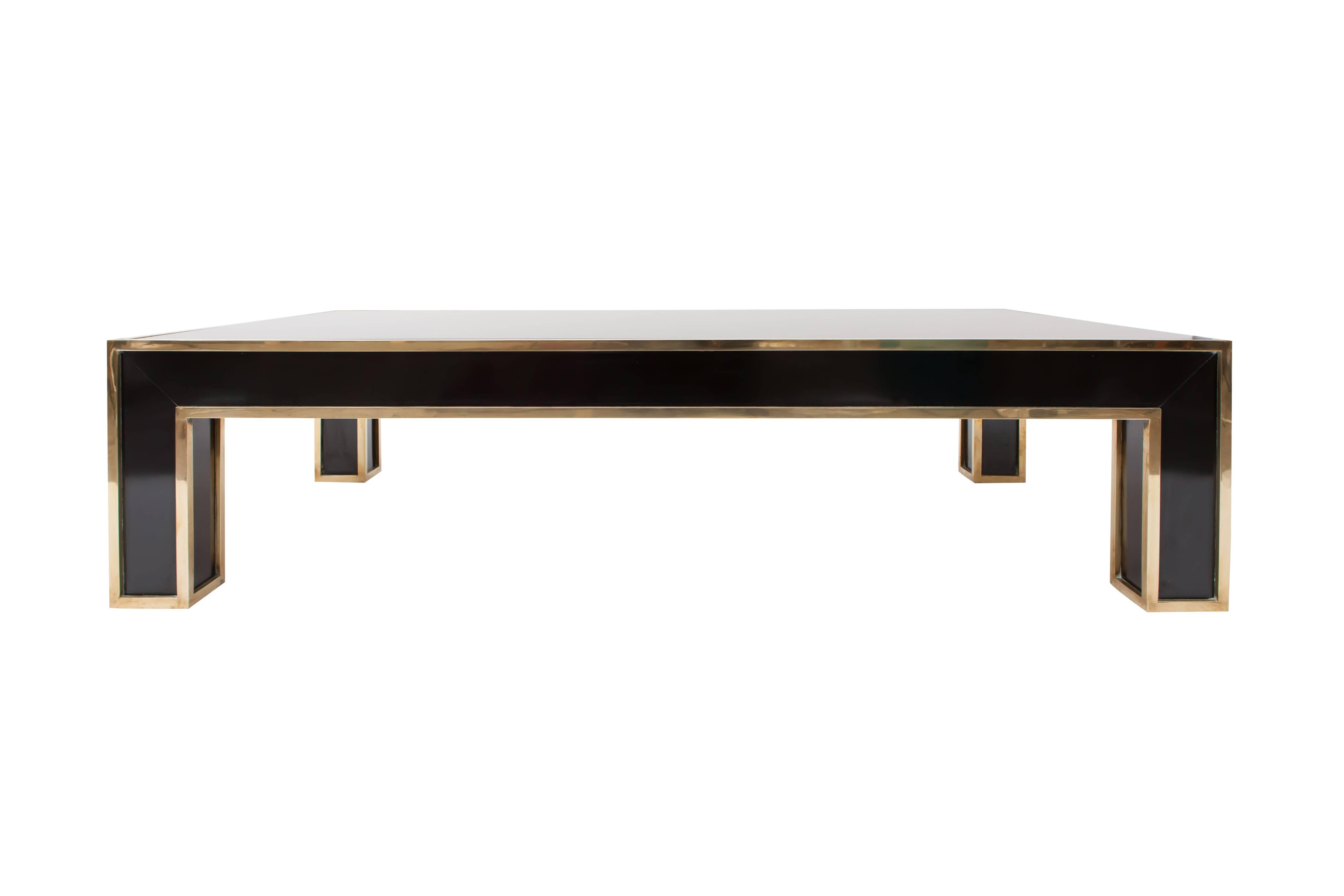 Romeo Rega designed this Black and Brass Rectangular Coffee Table
Italy, 1970s.
Black laminate, brass, smoked glass.
Measure: L 125 cm x W 80 cm x H 35 cm.
Would fit well in an eclectic interior inspired by Maison Jansen, Willy rizzo or other