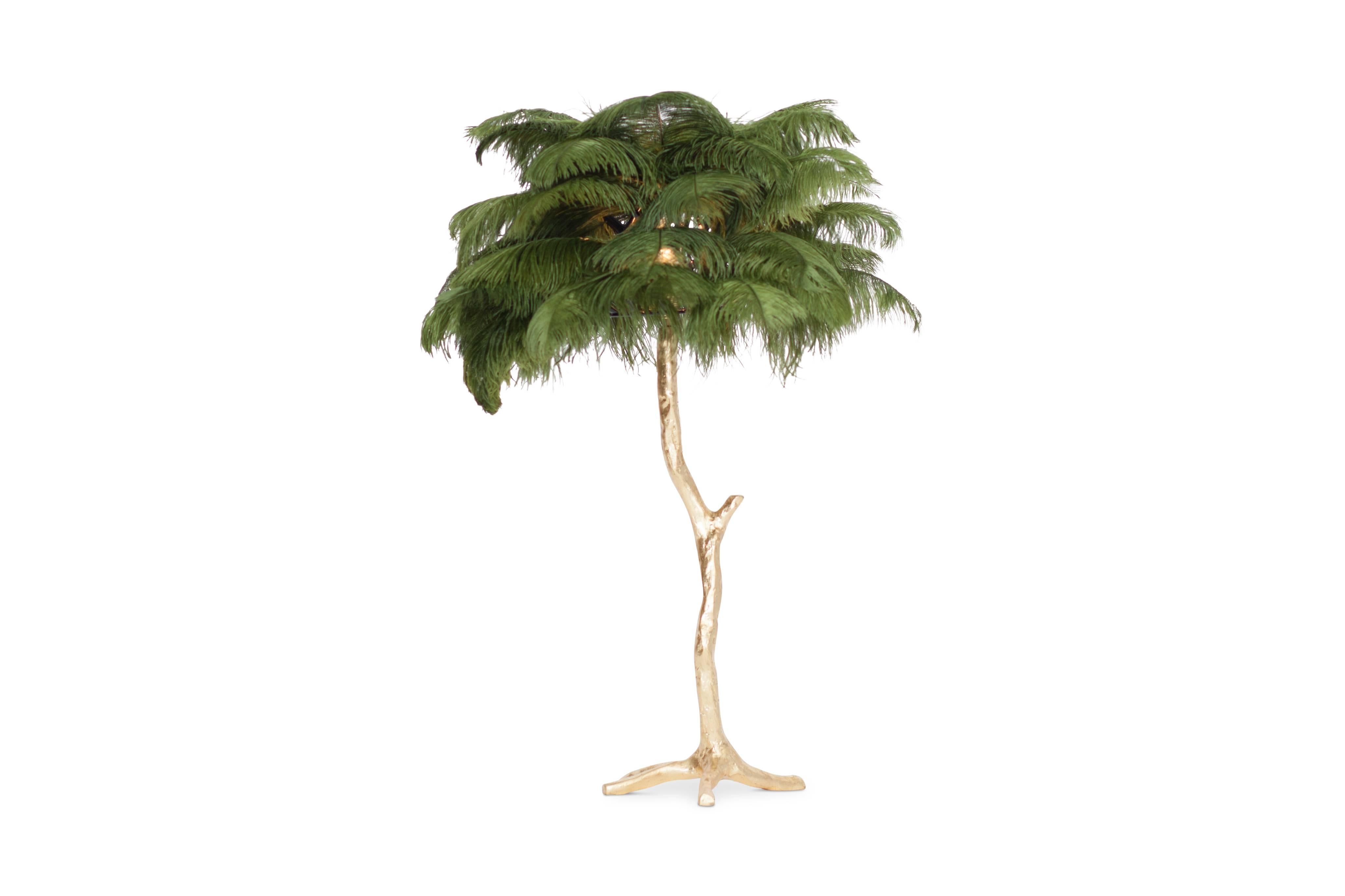 Small palm tree feather floor or table lamp.

Available as a single or as a pair

Hollywood regency in the manner of Duval Brasseur 
Gold finished base with aubergine colored ostrich feathers

highly decorative piece.

Measure: H 85 cm x ø