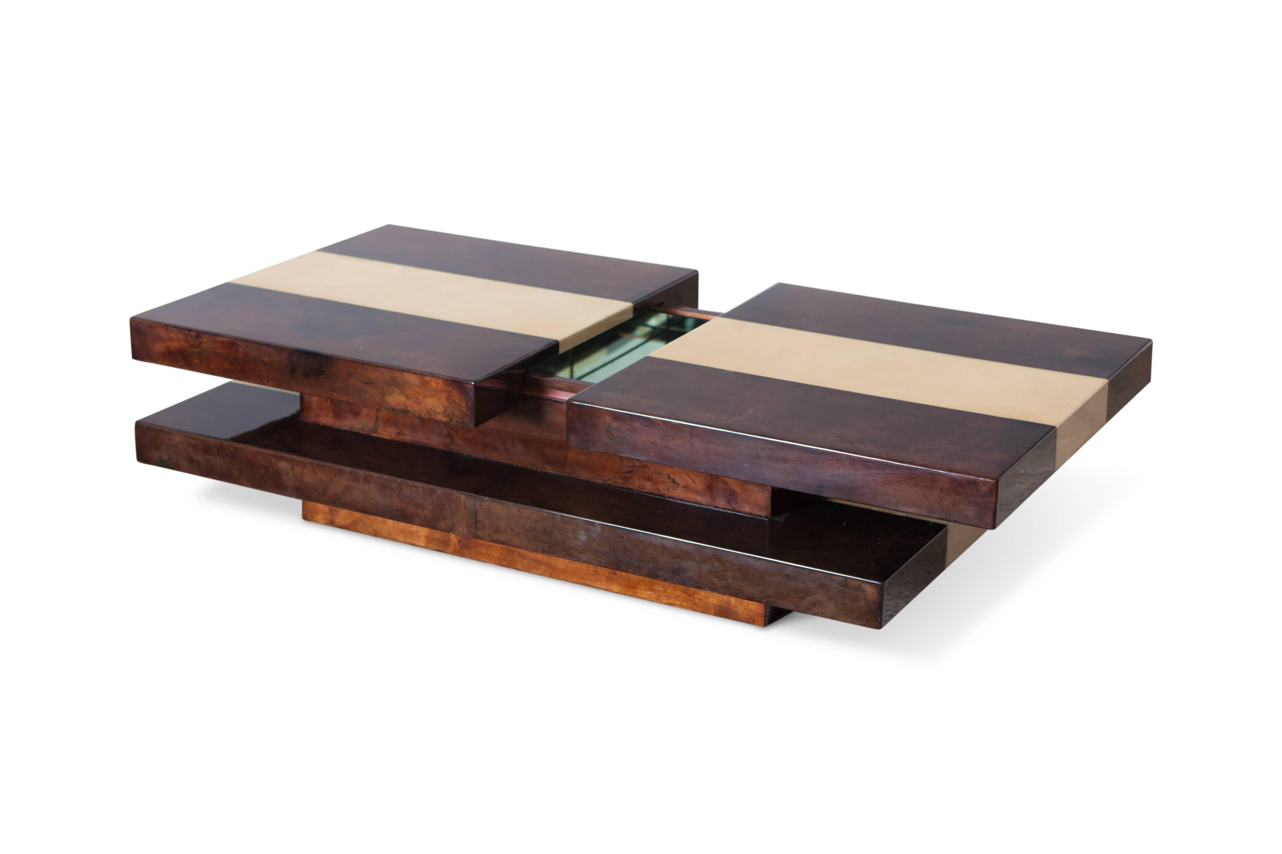 Italian Aldo Tura two tier sliding coffee table with hidden bar