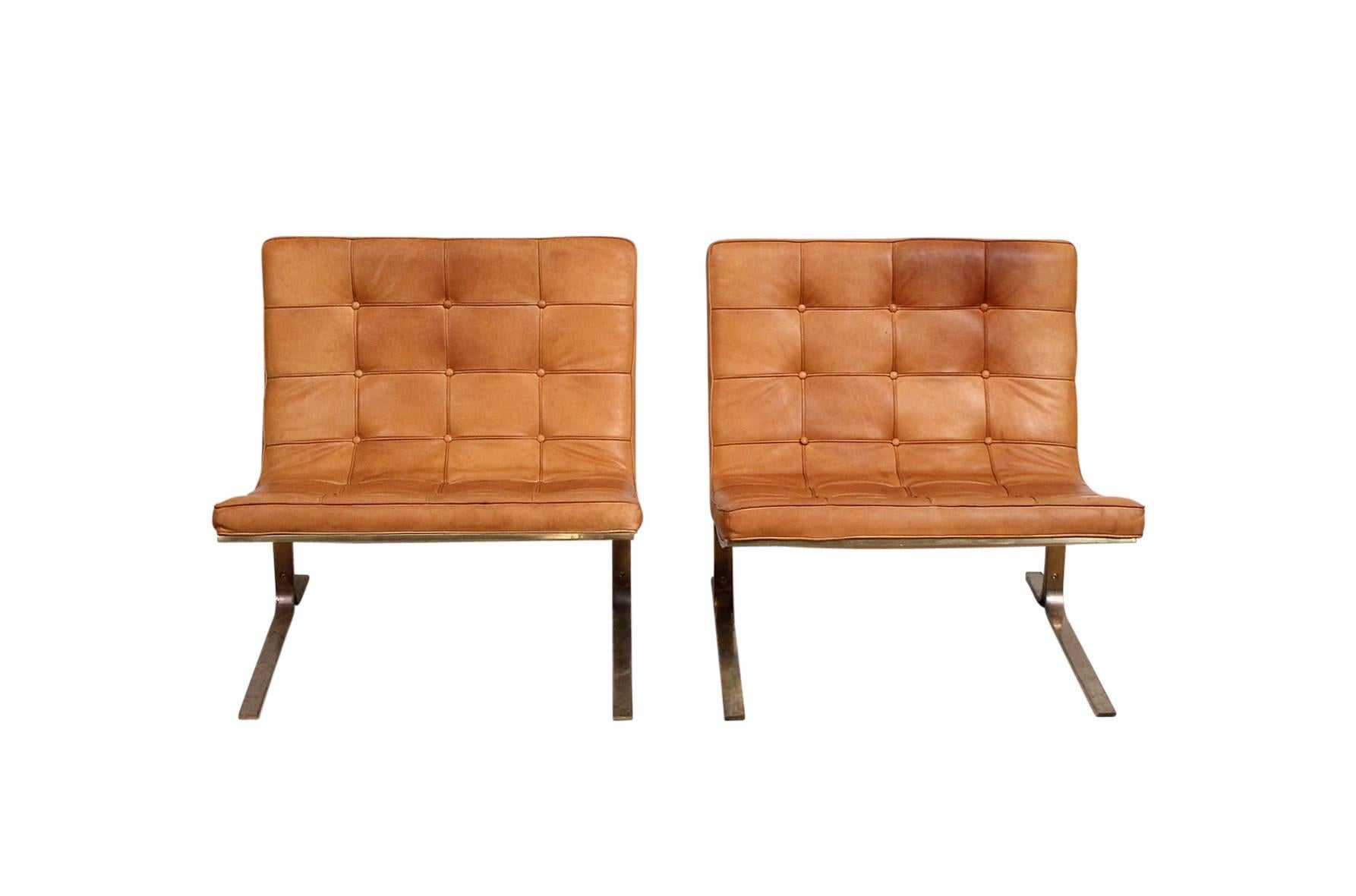 Tufted brown leather CH28 lounge chair with cantilevered bronze finish bases designed by Nicos Zographos. Designed by Zographos while working at Skidmore, Owens and Merrill, circa 1960. Very minimal and chic design.

We can have the frames