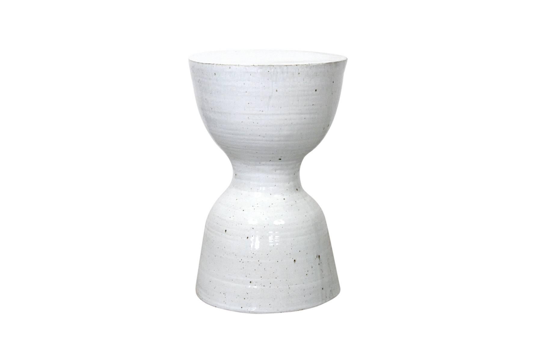 Larger scaled white glazed hourglass ceramic stool or table by Tariki Studio. This piece features a delicate textural white glaze inspired by the work of renowned British studio potter Bernard Howell Leach. Known at Studio Tariki as the 
