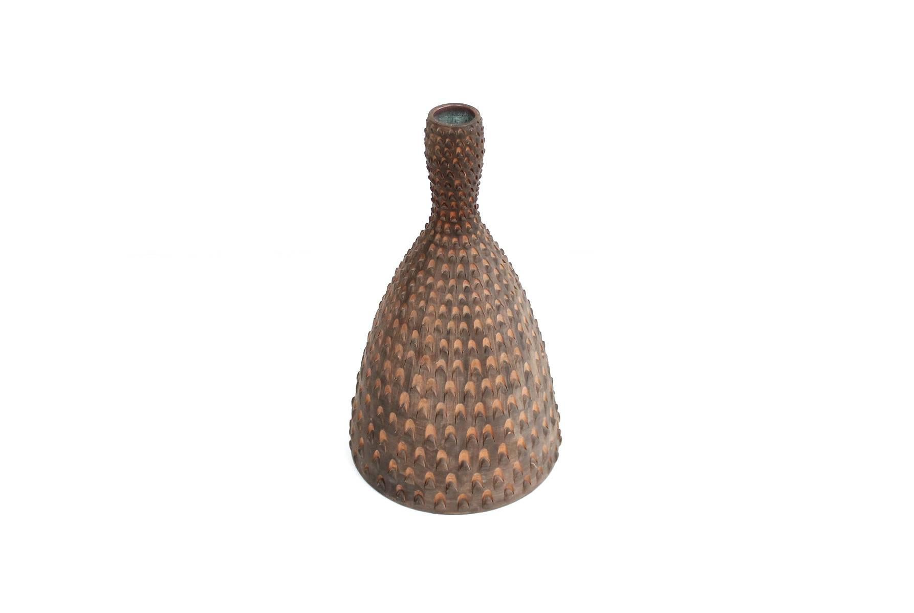 Stunning Italian pottery vase for Raymor. Ceramic body with applied technique that resembles a pinecone and a brilliant aquamarine interior glaze.