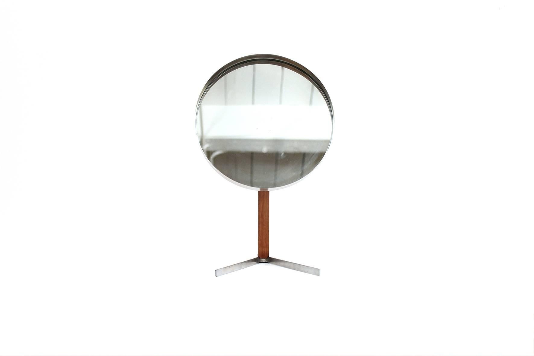 Superb table or vanity mirror in the style of the Swedish company Luxus. This particular example in teak and chromed steel. Produced by Durlston in the 1960s. Attractive cantilevered design and useful form.