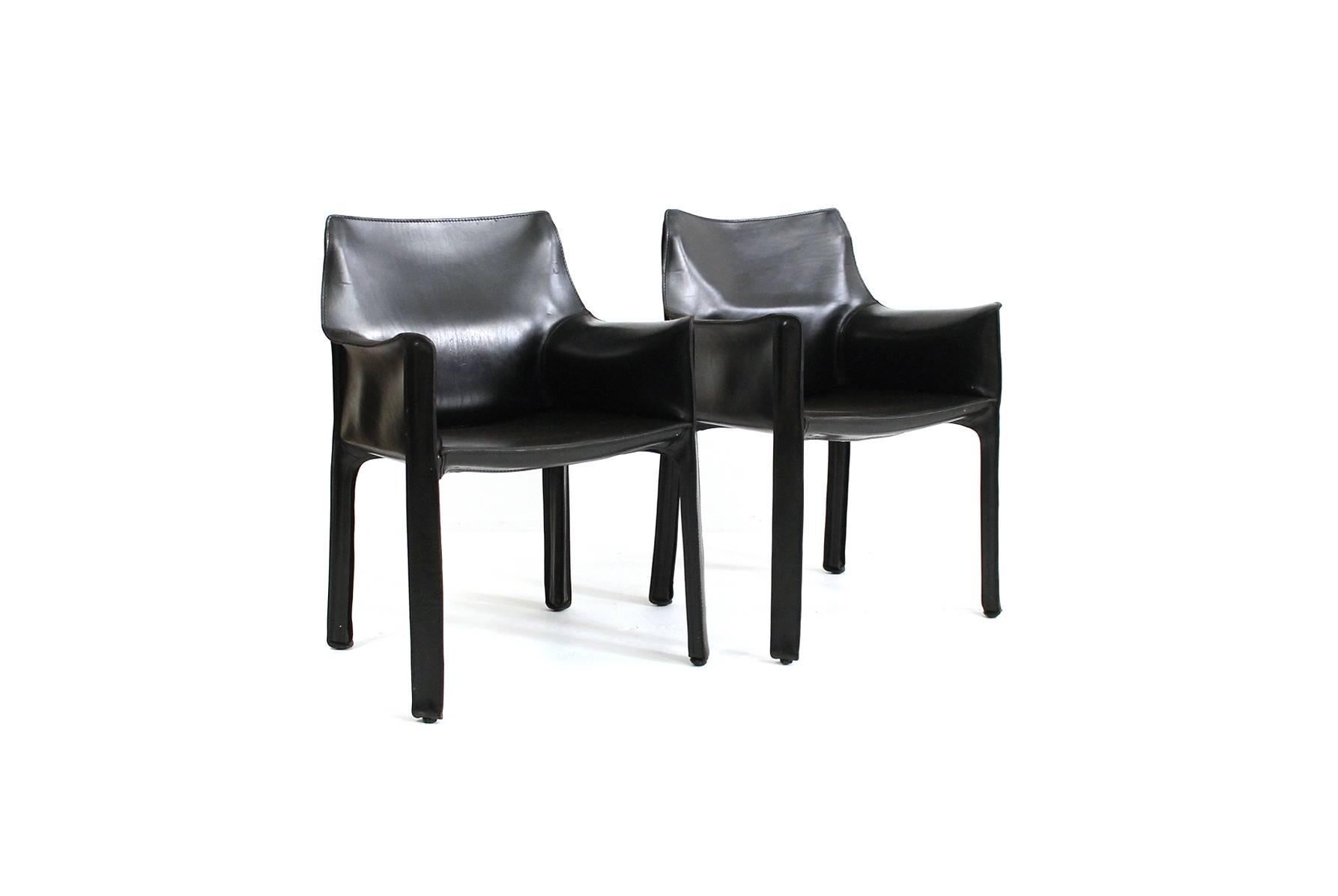Very nice matched pair of CAB black leather armchairs designed for Cassina by Mario Bellini.  Suitable for dining or occasional chair use.