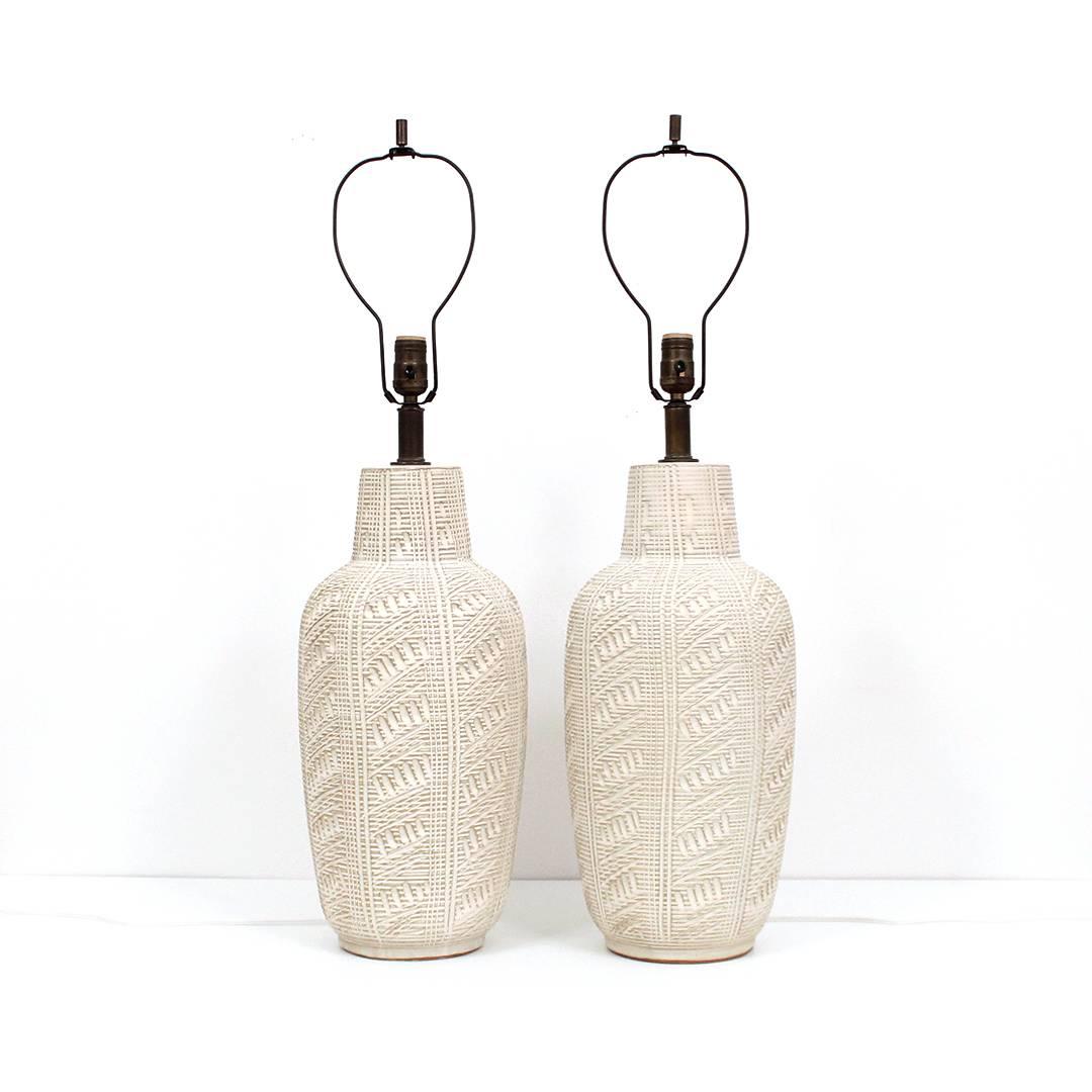 Superb matching pair of ceramic table lamps by Lee Rosen for Design Technics. Lamps executed in the 