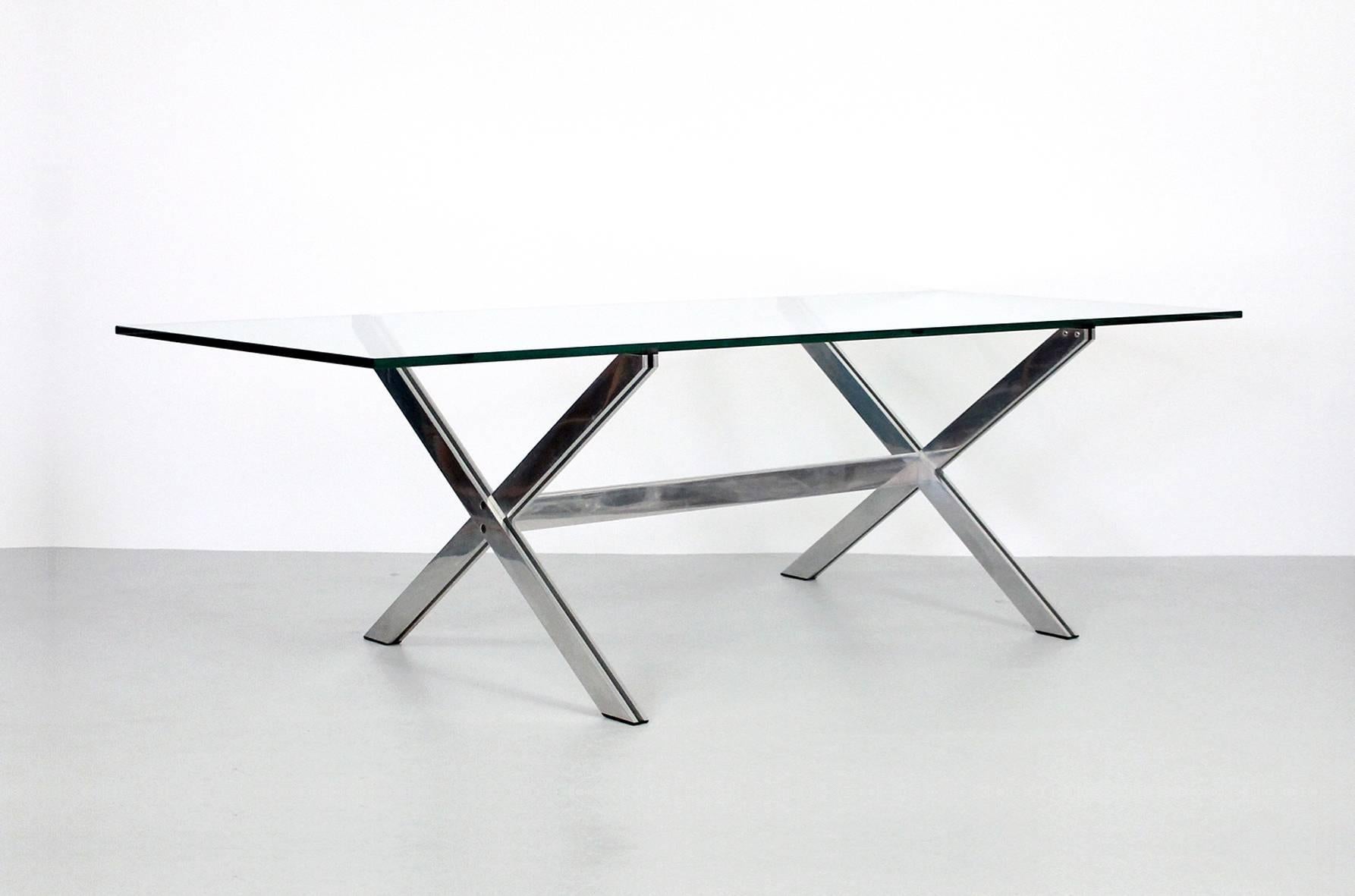 Large dining or conference table with polished aluminium X base and glass top designed by John Vesey. These pieces are expertly built with subtle architectural details that epitomize a chic 1970s aesthetic.