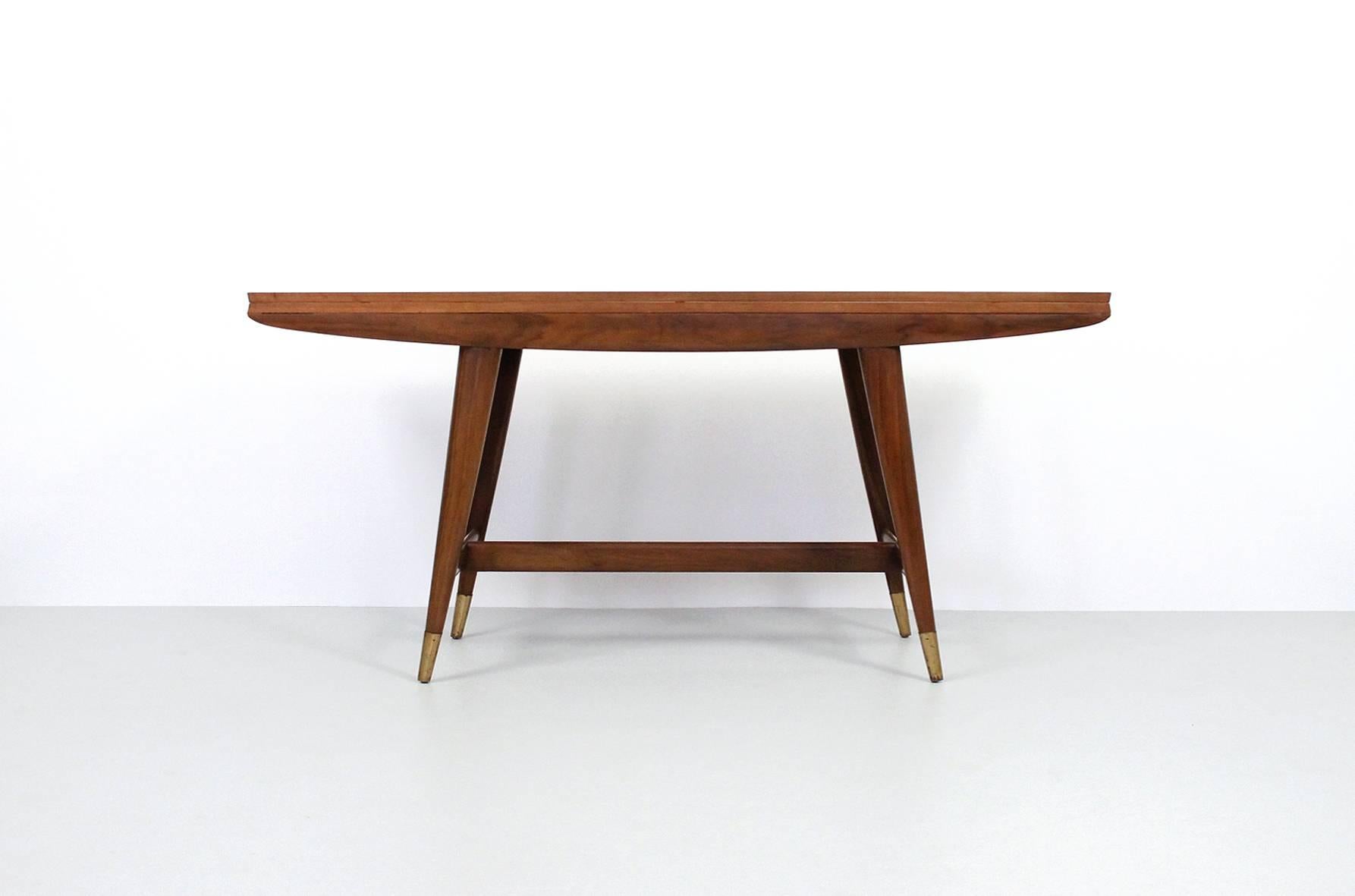 Gio Ponti for Singer & Sons flip-top console or dining table. Executed in walnut with brass hinges and sabots. This is model 2134 from the 