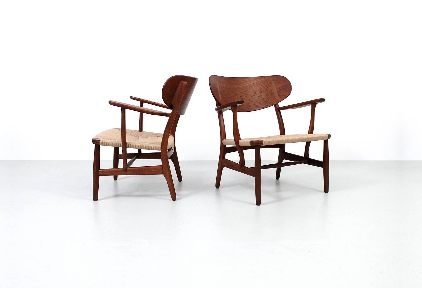 Scandinavian Modern Pair of CH22 Lounge Chairs by Hans Wegner