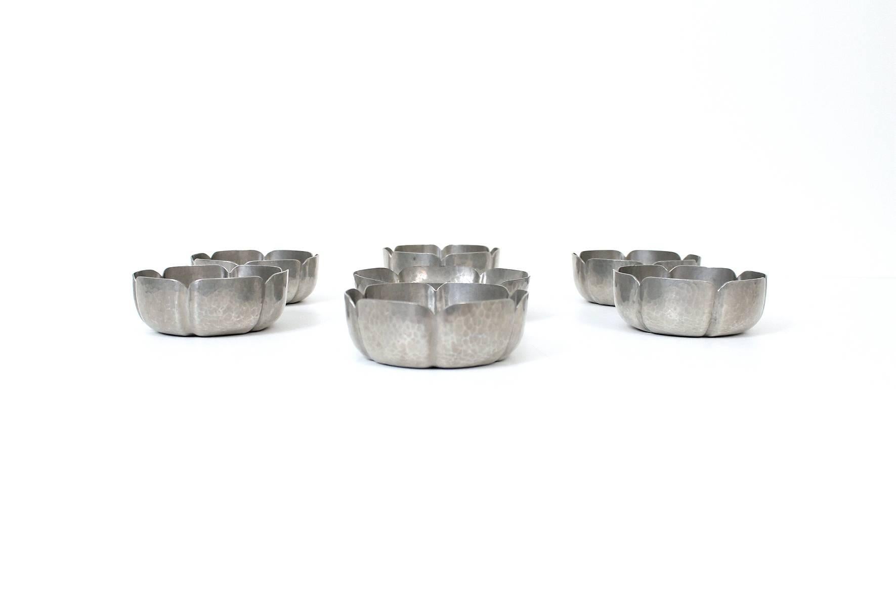 Boston school Arts & Crafts pewter bowl serving set by George Gebelein. Hand hammered floriform design. Signed with the impressed Gebelein mark to the underside. Dimensions below for smaller bowls. Larger bowl dimensions: H: 1.5
