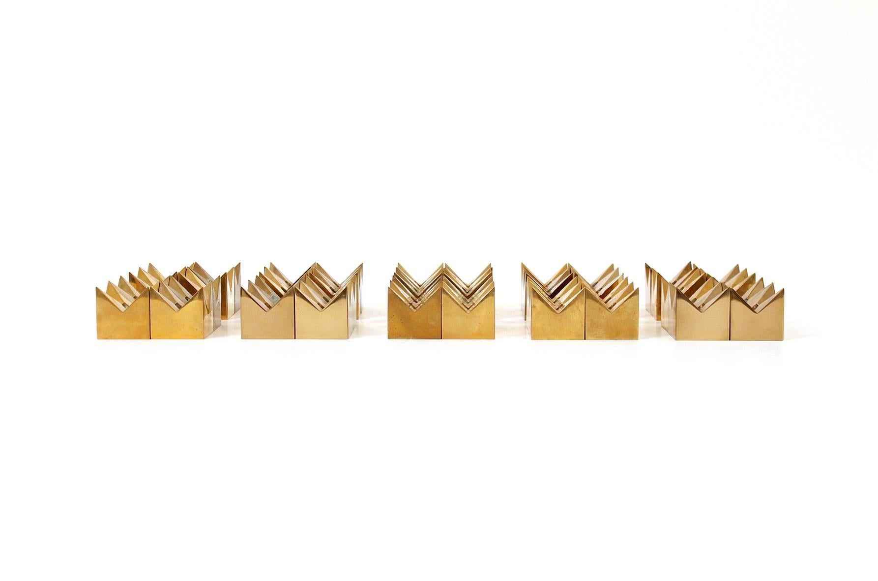Collection of 40 brass candleholders by Pierre Forssell for the Swedish firm Skultuna. Graphic group of small functional sculptures. Impressed mark to underside of each example. Dimensions below for each candleholder.