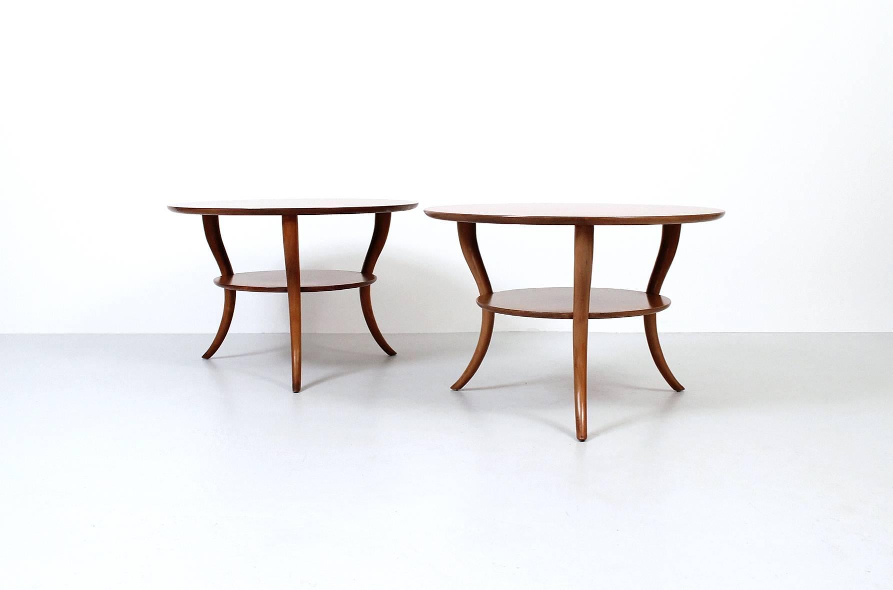 Pair of saber leg side tables designed by T.H. Robsjohn-Gibbings for Widdicomb.