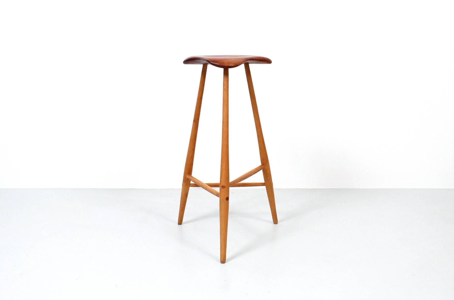 Studio furniture barstool by Horace B. Hartshaw. Hartshaw was Wharton Esherick's studio assistant. This stool is identical to those made by Esherick. Signed and dated. Cherry seat and hickory legs.